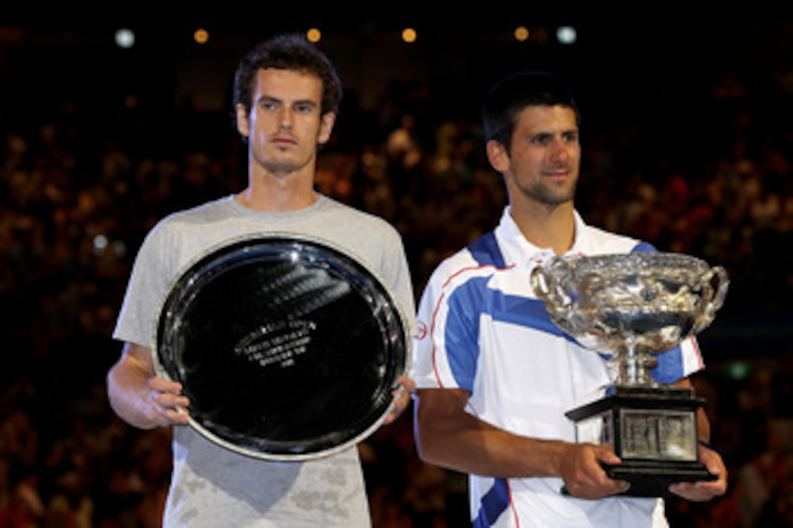 MELBOURNE, AUSTRALIA - JANUARY 30: Novak Djokovic of Serbia (R) poses with the Norman Brookes Challenge Cup after winning his men's final match against Andy Murray of Great Britain (L) during day fourteen of the 2011 Australian Open at Melbourne Park on MELBOURNE, AUSTRALIA - JANUARY 30: Novak Djokovic of Serbia (R) poses with the Norman Brookes Challenge Cup after winning his men's final match against Andy Murray of Great Britain (L) during day fourteen of the 2011 Australian Open at Melbourne Park on