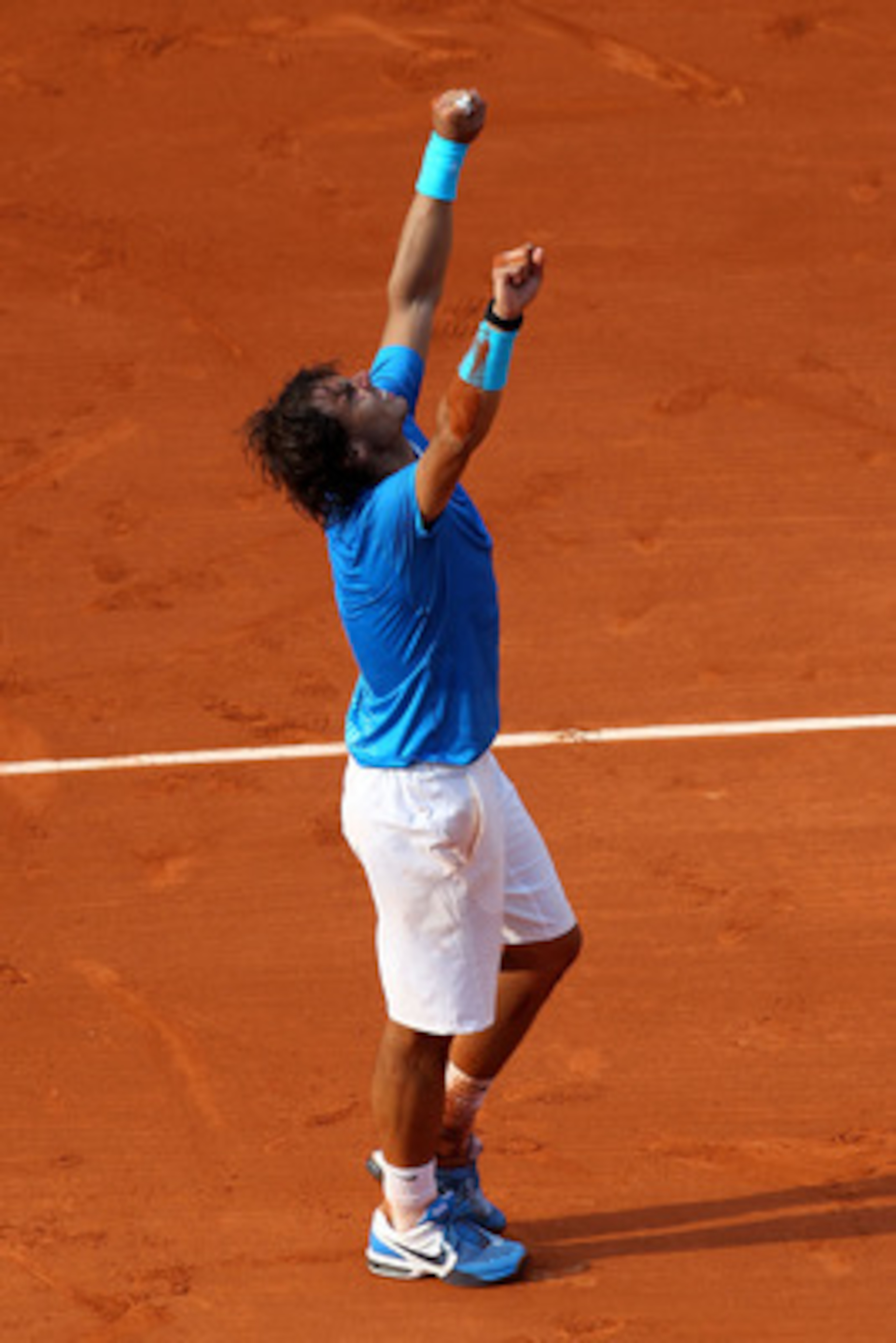 PARIS, FRANCE - JUNE 05:  Rafael Nadal of Spain celebrates following his victory during the men's singles final match between Rafael Nadal of Spain and Roger Federer of Switzerland on day fifteen of the French Open at Roland Garros on June 5, 2011 in Pari