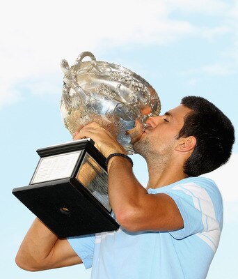 MELBOURNE, AUSTRALIA - JANUARY 31: Novak Djokovic of Serbia poses with the Norman Brookes Challenge Cup at the Melbourne Cricket Ground on January 31, 2011 in Melbourne, Australia.  (Photo by Mark Dadswell/Getty Images)