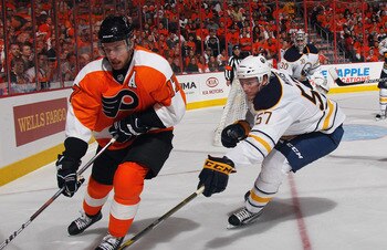 PHILADELPHIA, PA - APRIL 14: Tyler Myers #57 of the Buffalo Sabres checks Jeff Carter #17 of the Philadelphia Flyers in Game One of the Eastern Conference Quarterfinals during the 2011 NHL Stanley Cup Playoffs at Wells Fargo Center on April 14, 2011 in Ph