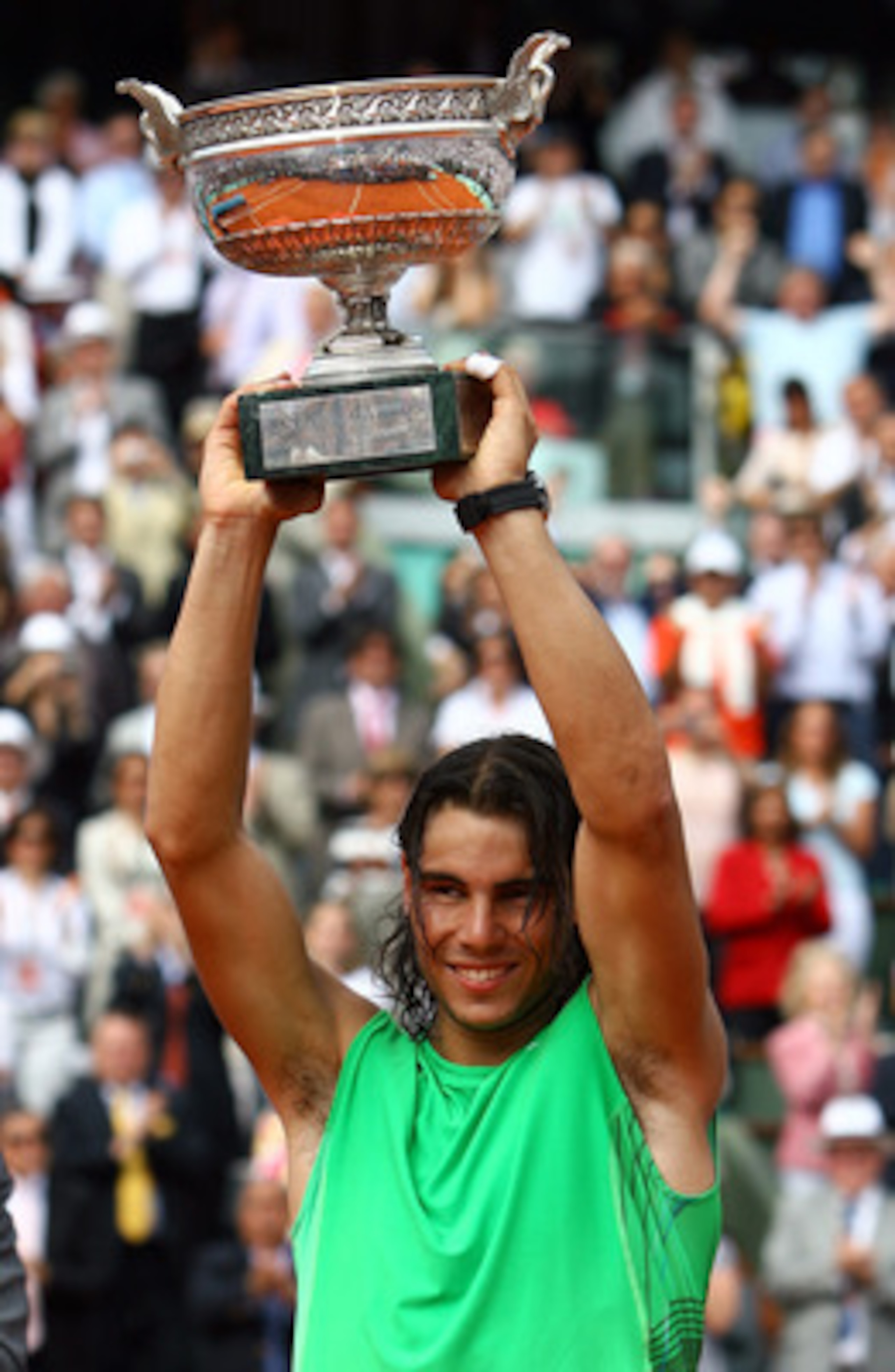 PARIS - JUNE 08: Rafael Nadal of Spain lifts the trophy after defeating Roger Federer of Switzerland after the Men's Singles Final match on day fifteen of the French Open at Roland Garros on June 8, 2008 in Paris, France. (Photo by Julian Finney/Getty I PARIS - JUNE 08: Rafael Nadal of Spain lifts the trophy after defeating Roger Federer of Switzerland after the Men's Singles Final match on day fifteen of the French Open at Roland Garros on June 8, 2008 in Paris, France. (Photo by Julian Finney/Getty I