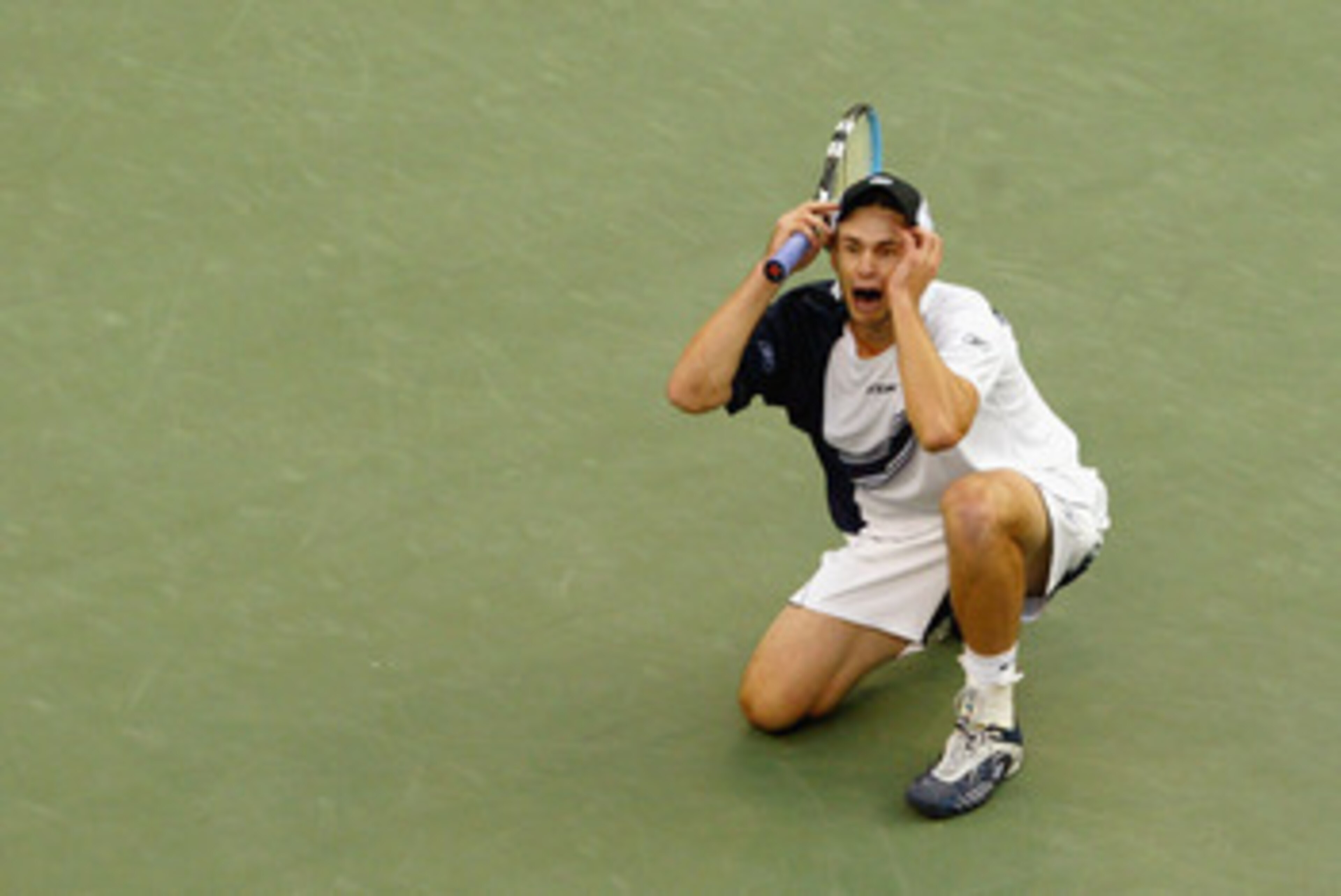 FLUSHING, NY - SEPTEMBER 7:  Andy Roddick celebrates match point against Juan Carlos Ferrero of Spain during the US Open men's singles final at Arthur Ashe Stadium in the USTA National Tennis Center on September 7, 2003 in Flushing, New York.  Roddick def