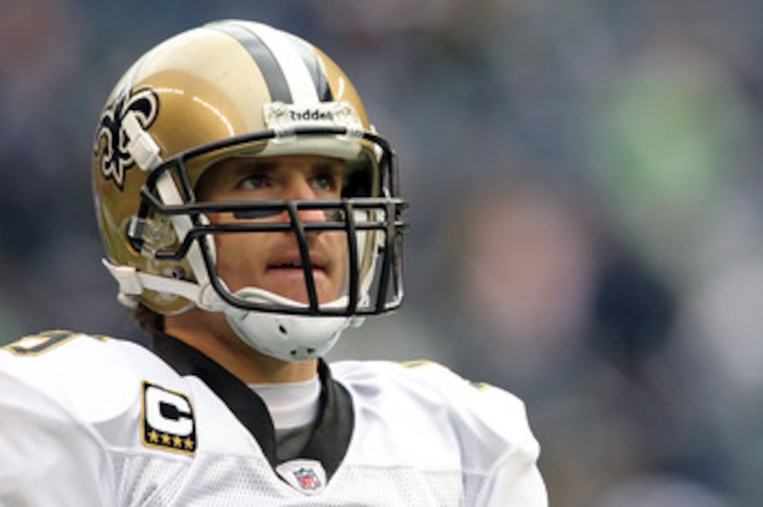 SEATTLE, WA - JANUARY 08: Quarterback Drew Brees #9 of the New Orleans Saints looks on before taking on the Seattle Seahawks during the 2011 NFC wild-card playoff game at Qwest Field on January 8, 2011 in Seattle, Washington. (Photo by Jonathan Ferrey/G SEATTLE, WA - JANUARY 08: Quarterback Drew Brees #9 of the New Orleans Saints looks on before taking on the Seattle Seahawks during the 2011 NFC wild-card playoff game at Qwest Field on January 8, 2011 in Seattle, Washington. (Photo by Jonathan Ferrey/G