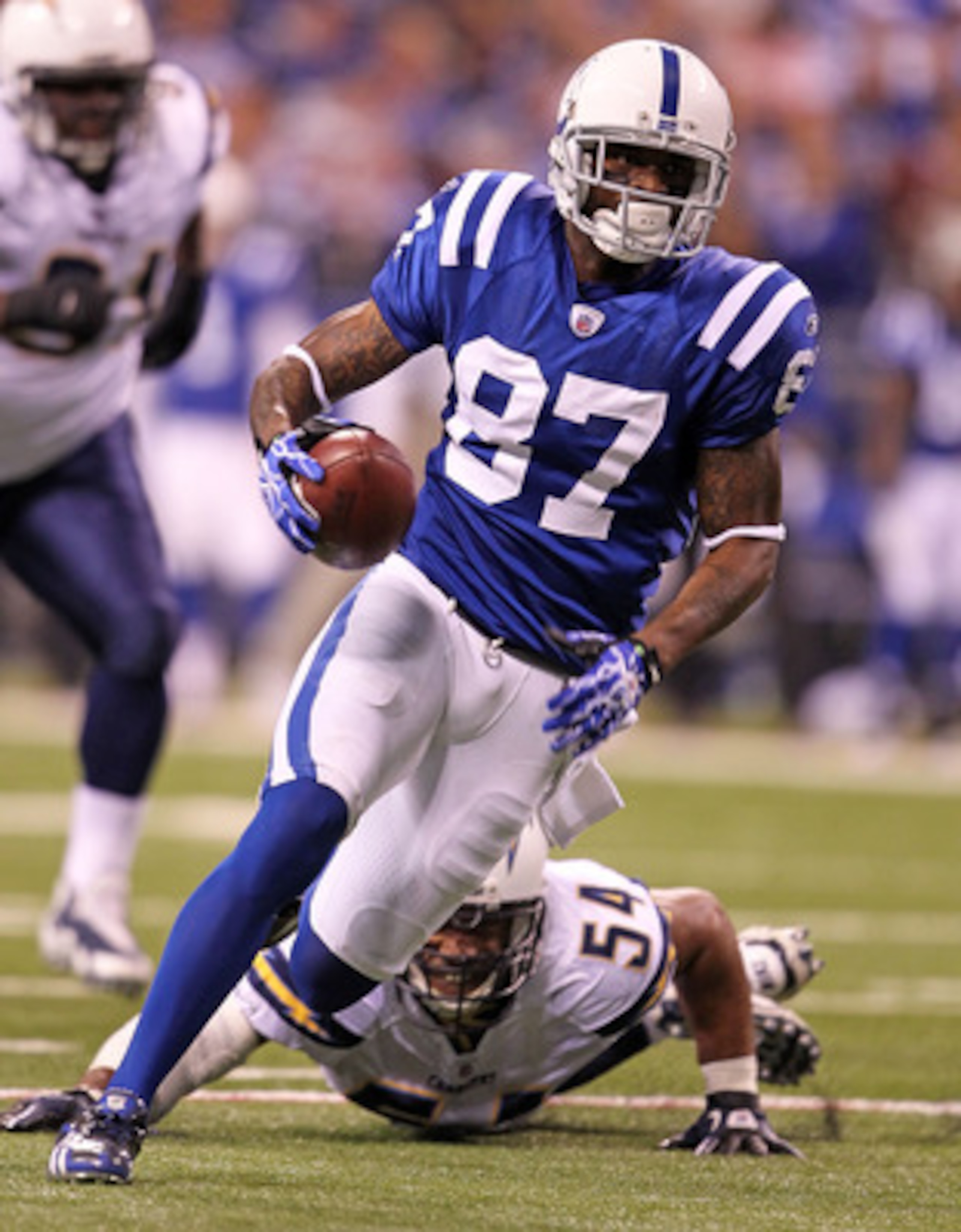 INDIANAPOLIS - NOVEMBER 28: Reggie Wayne #87 of the Indianapolis Colts runs with the ball during the NFL game against the San Diego Chargers at Lucas Oil Stadium on November 28, 2010 in Indianapolis, Indiana. (Photo by Andy Lyons/Getty Images) INDIANAPOLIS - NOVEMBER 28: Reggie Wayne #87 of the Indianapolis Colts runs with the ball during the NFL game against the San Diego Chargers at Lucas Oil Stadium on November 28, 2010 in Indianapolis, Indiana. (Photo by Andy Lyons/Getty Images)