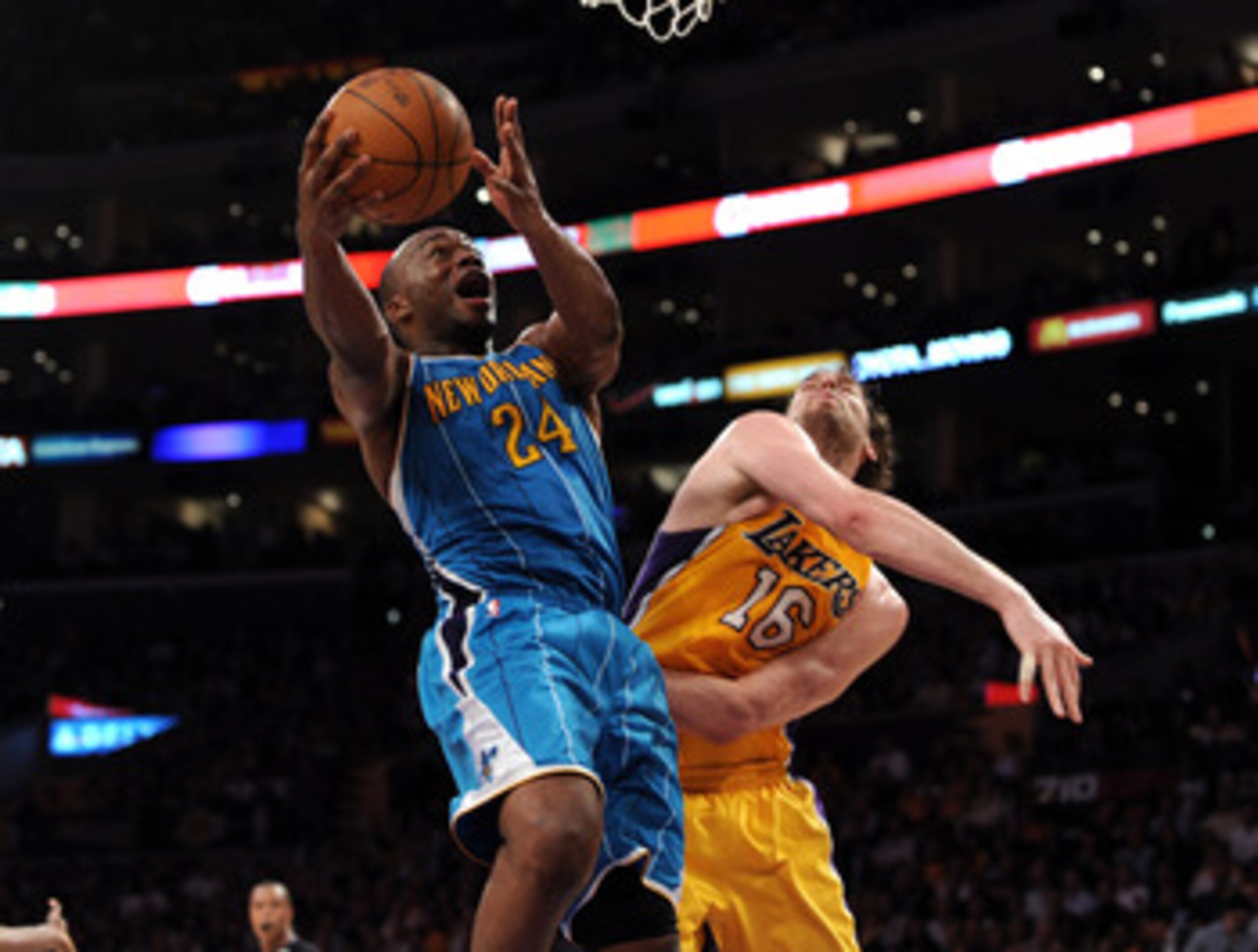 LOS ANGELES, CA - APRIL 26:  Carl Landry #24 of the New Orleans Hornets goes up for a shot against Pau Gasol #16 of the Los Angeles Lakers in the third quarter in Game Five of the Western Conference Quarterfinals in the 2011 NBA Playoffs on April 26, 2011