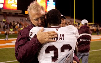 AUSTIN, TX - NOVEMBER 25:  Mike Sherman, head coach of Texas A&M, embraces running back Cyrus Gray #32 following Texas A&M's 24-17 win over The University of Texas at Darrell K. Royal-Texas Memorial Stadium on November 25, 2010 in Austin, Texas. (Photo by