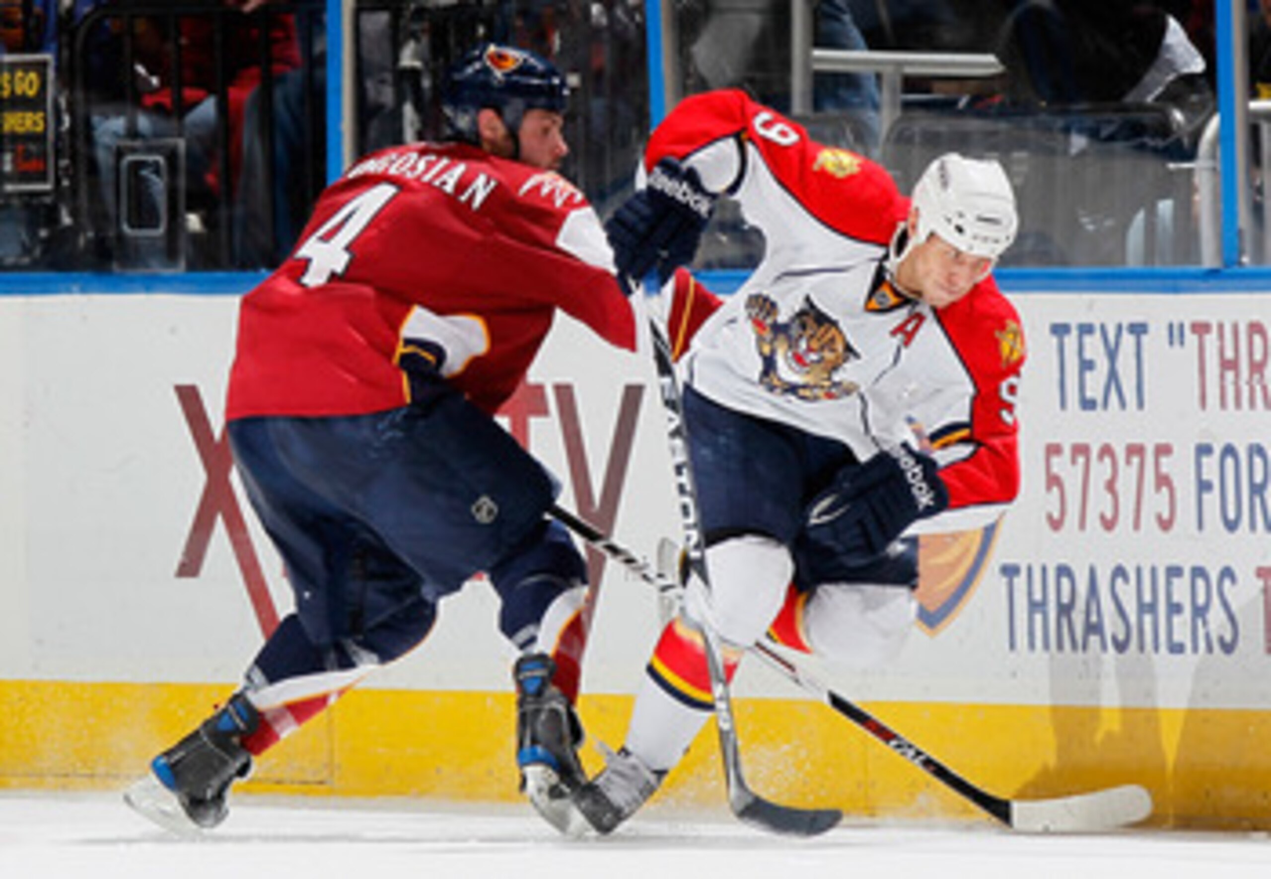 ATLANTA, GA - FEBRUARY 25: Zach Bogosian #4 of the Atlanta Thrashers battles for the puck against Stephen Weiss #9 of the Florida Panthers at Philips Arena on February 25, 2011 in Atlanta, Georgia. (Photo by Kevin C. Cox/Getty Images) ATLANTA, GA - FEBRUARY 25: Zach Bogosian #4 of the Atlanta Thrashers battles for the puck against Stephen Weiss #9 of the Florida Panthers at Philips Arena on February 25, 2011 in Atlanta, Georgia. (Photo by Kevin C. Cox/Getty Images)
