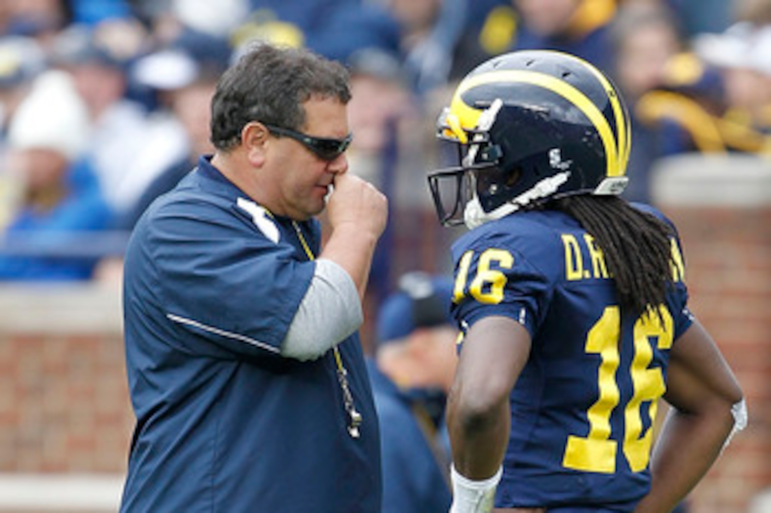 ANN ARBOR, MI - APRIL 16:  Head football coach Brady Hoke talks with Denard Robinson #16 during the annual Spring Game at Michigan Stadium on April 16, 2011 in Ann Arbor, Michigan.  (Photo by Leon Halip/Getty Images)