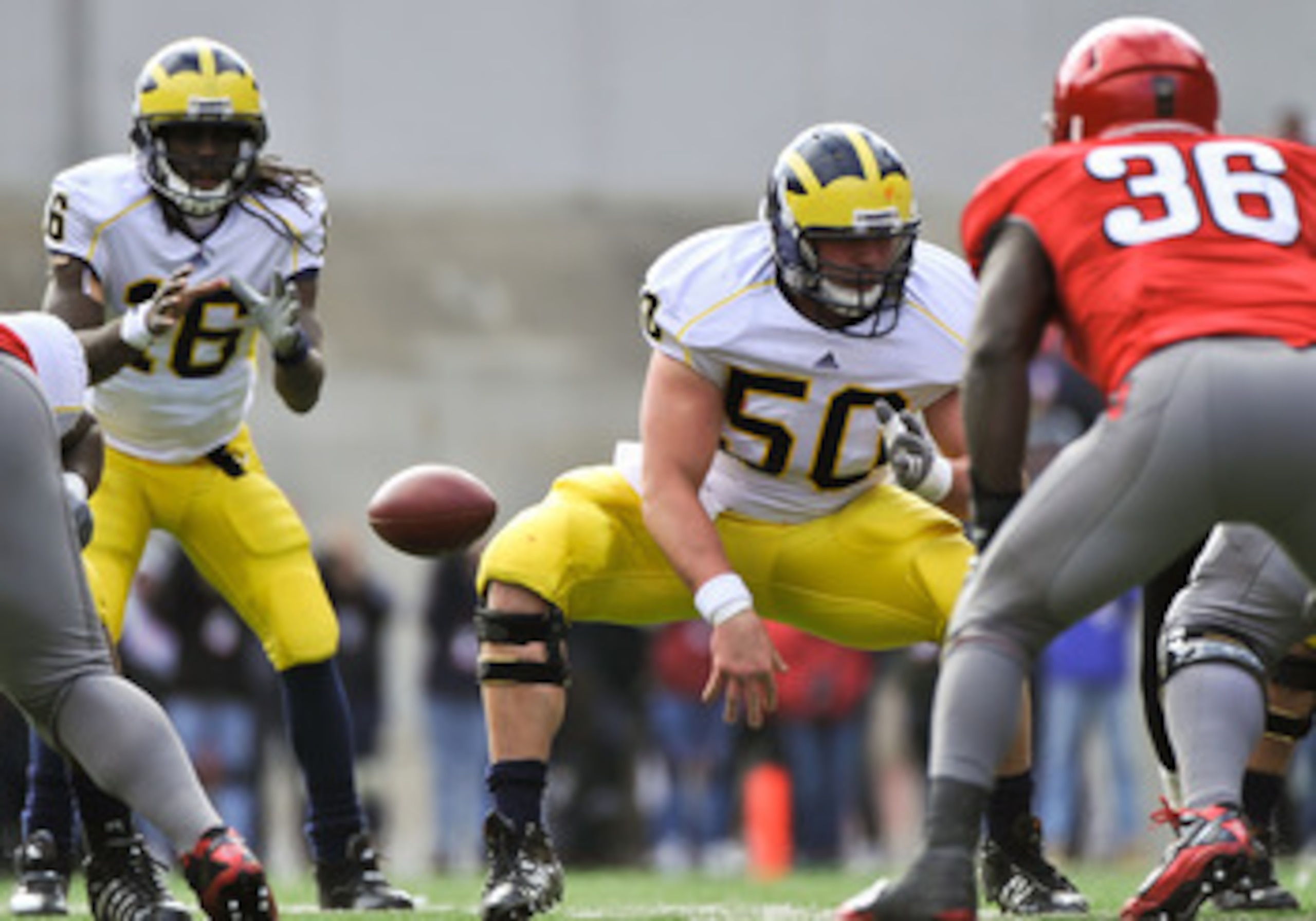 COLUMBUS, OH - NOVEMBER 27:  David Molk #50 of the Michigan Wolverines blocks against the Ohio State Buckeyes at Ohio Stadium on November 27, 2010 in Columbus, Ohio.  (Photo by Jamie Sabau/Getty Images)