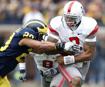 ANN ARBOR, MI - NOVEMBER 21: Terrelle Pryor #2 of the Ohio State Buckeyes tries to get around Troy Woolfolk #29 of the Michigan Wolverines on November 21, 2009 at Michigan Stadium in Ann Arbor, Michigan. (Photo by Gregory Shamus/Getty Images) ANN ARBOR, MI - NOVEMBER 21: Terrelle Pryor #2 of the Ohio State Buckeyes tries to get around Troy Woolfolk #29 of the Michigan Wolverines on November 21, 2009 at Michigan Stadium in Ann Arbor, Michigan. (Photo by Gregory Shamus/Getty Images)