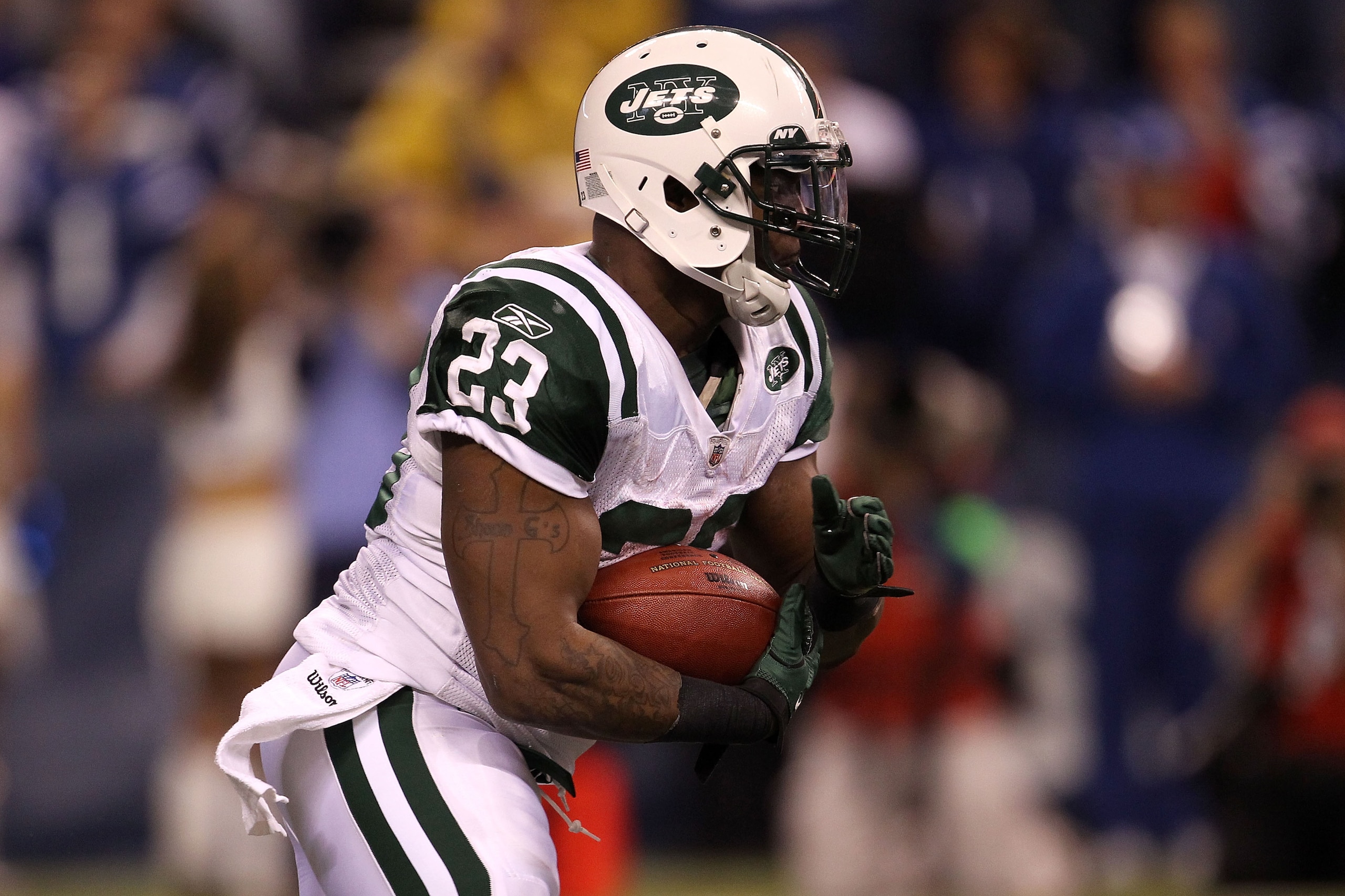 INDIANAPOLIS, IN - JANUARY 08:  Shonn Greene #23 of the New York Jets runs the ball against the Indianapolis Colts during their 2011 AFC wild card playoff game at Lucas Oil Stadium on January 8, 2011 in Indianapolis, Indiana. The Jets won 17-16. (Photo by