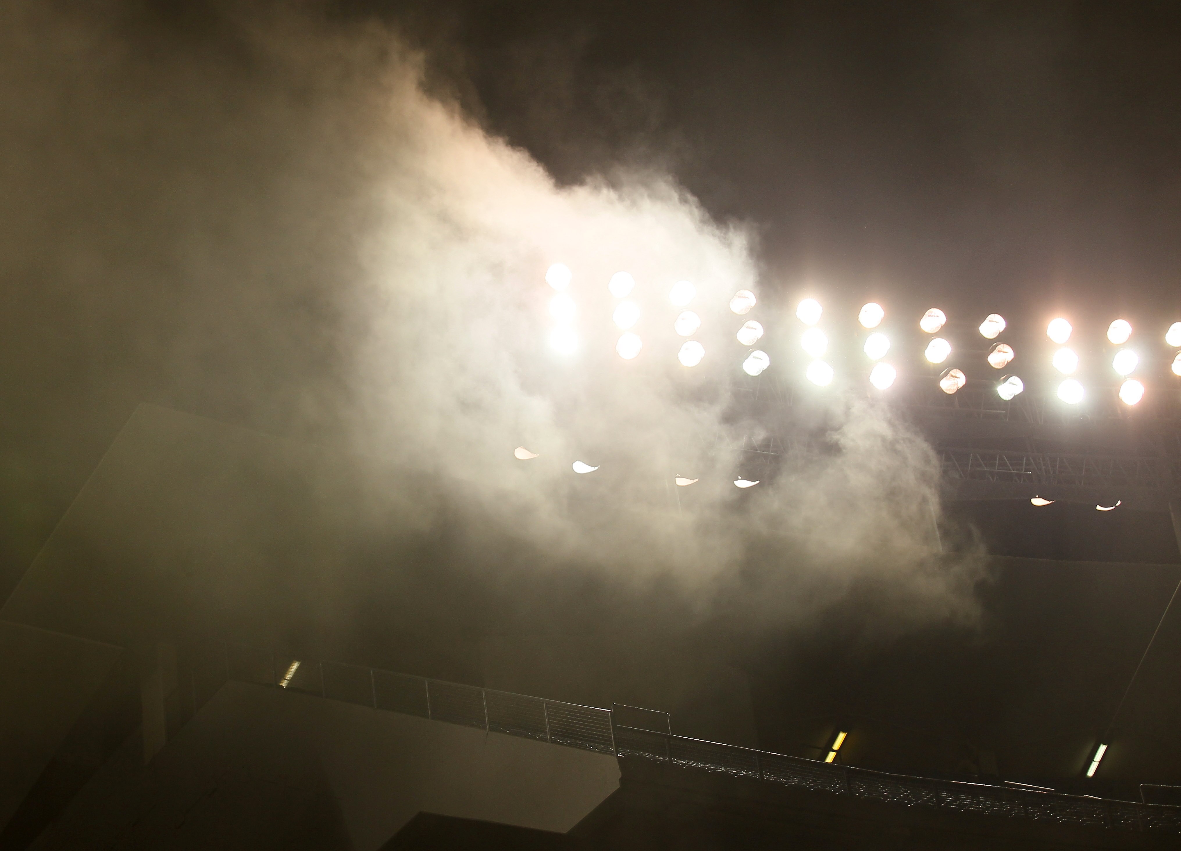 LOS ANGELES - MAY 28:  Smoke from a storage room fire rises past the lights in the upper decks during the game between the Florida Marlins and the Los Angeles Dodgers on May 28, 2011 at Dodger Stadium in Los Angeles, California. The game was not interrupt