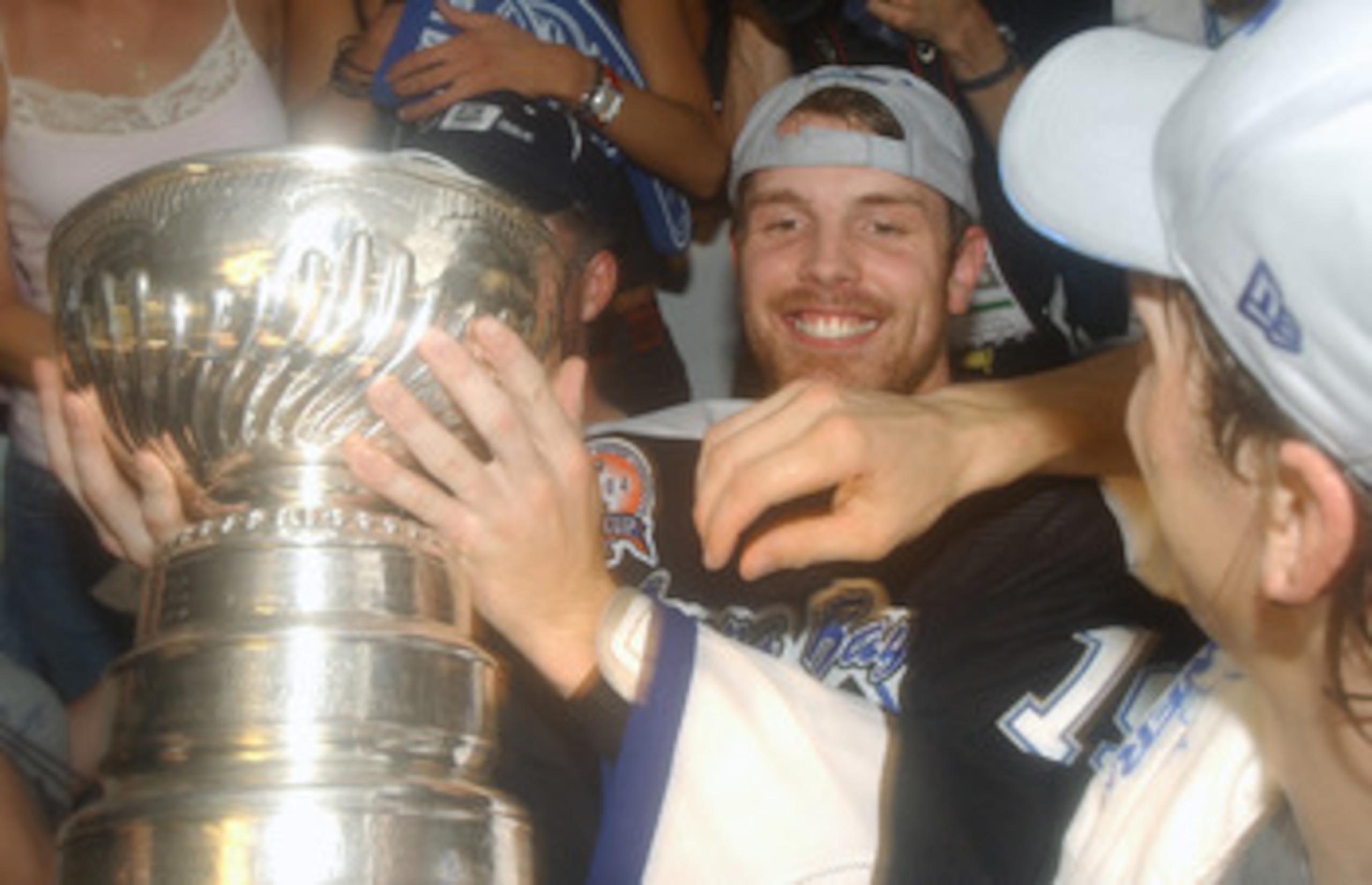 TAMPA, FL - JUNE 7:  Brad Richards #19 of the Tampa Bay Lightning smiles as he holds the Stanley Cup in the locker room after the victory over the Calgary Flames in Game seven of the NHL Stanley Cup Finals on June 7, 2004 at the St. Pete Times Forum in Ta