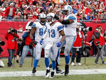 TAMPA, FL - DECEMBER 19:  Receiver Nate Burleson #13 of the Detroit Lions celebrates a touchdown against the Tampa Bay Buccaneers during the game at Raymond James Stadium on December 19, 2010 in Tampa, Florida.  (Photo by J. Meric/Getty Images)