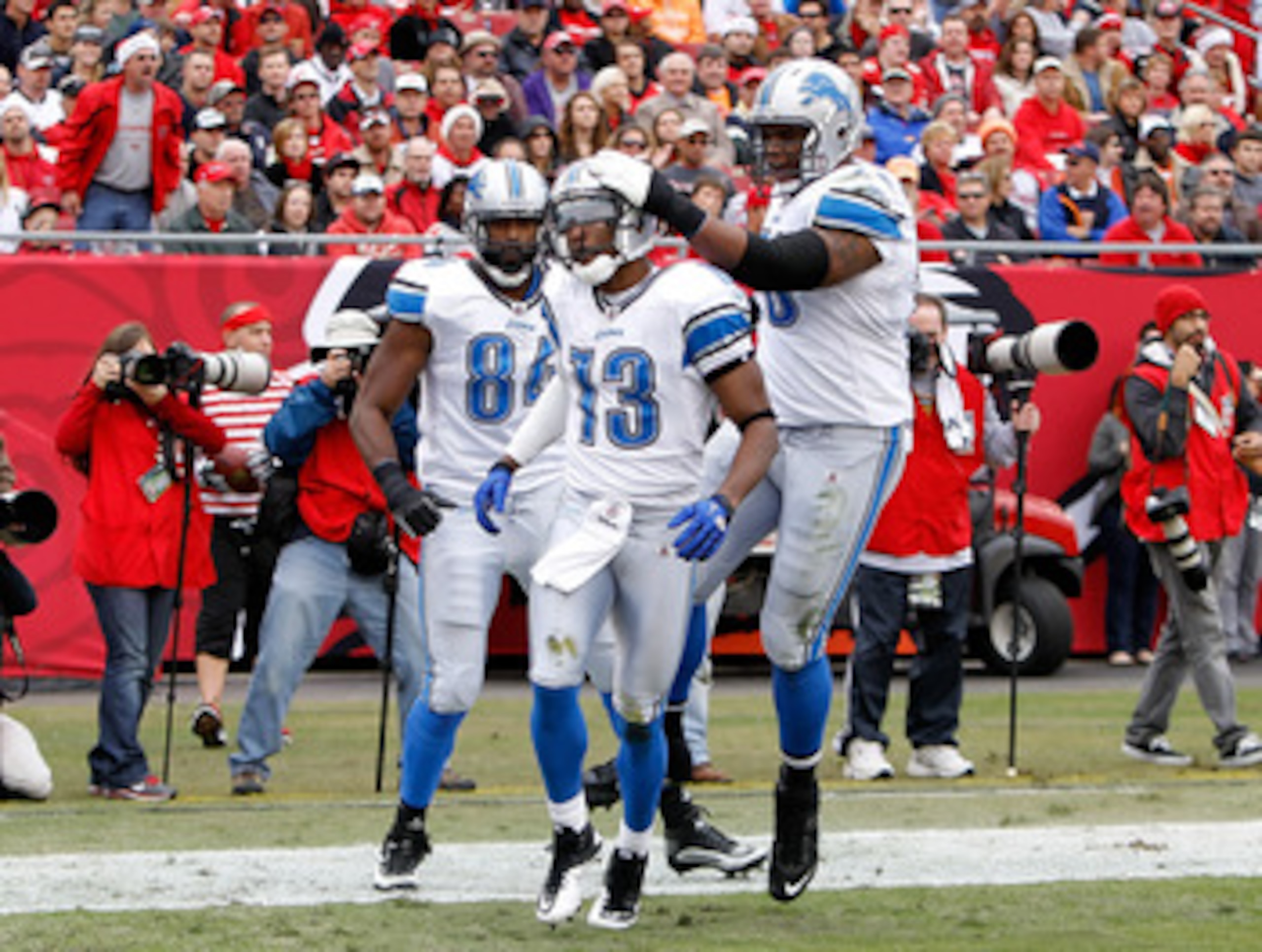 TAMPA, FL - DECEMBER 19:  Receiver Nate Burleson #13 of the Detroit Lions celebrates a touchdown against the Tampa Bay Buccaneers during the game at Raymond James Stadium on December 19, 2010 in Tampa, Florida.  (Photo by J. Meric/Getty Images)