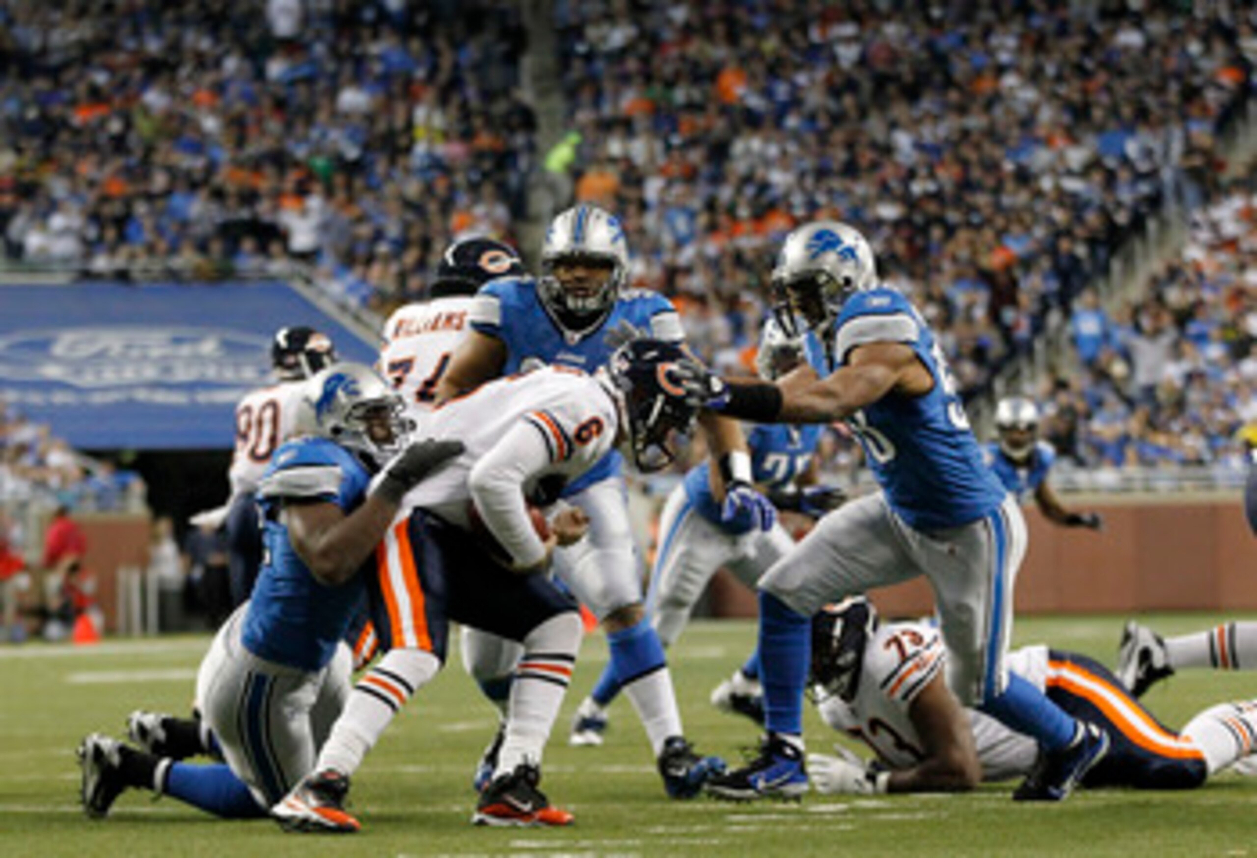 DETROIT - DECEMBER 05: Jay Cutler #6 of the Chicago Bears is sacked by Cliff Avril #92 and Julian Peterson #98 of the Detroit Lions as Ndamukong Suh #90 looks on during the game at Ford Field on December 5, 2010 in Detroit, Michigan. The Bears defeated th