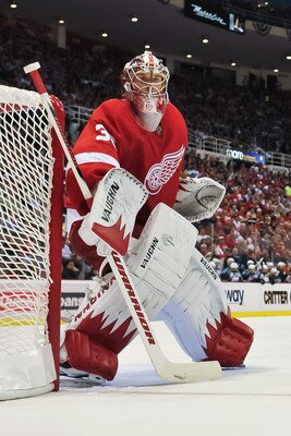 DETROIT - MAY 4: Goaltender Jimmy Howard #35 of the Detroit Red Wings guards the net against the San Jose Sharks in Game Three of the Western Conference Semifinals during the 2011 NHL Stanley Cup Playoffs on May 4, 2011 at Joe Louis Arena in Detroit, Mich