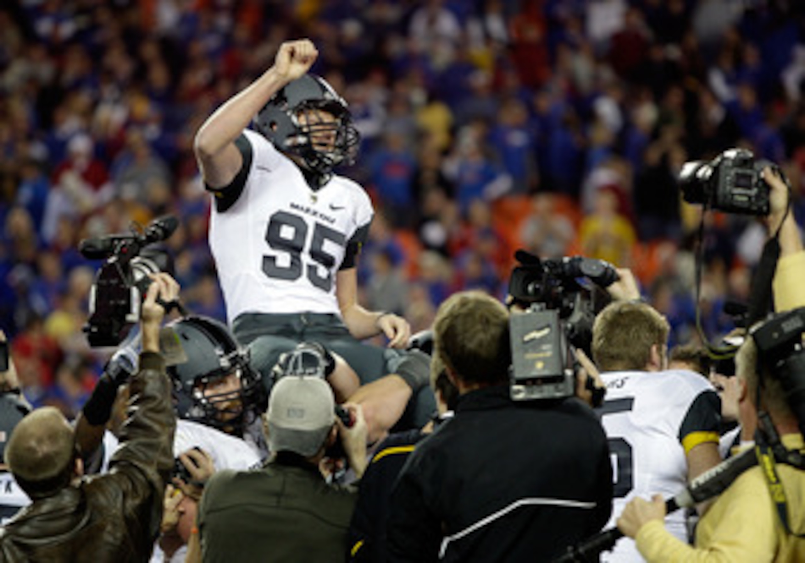 KANSAS CITY, MO - NOVEMBER 28:  Kicker Grant Ressel #95 of the Missouri Tigers is carried off the field after kicking the winning field goal to defeat the Kansas Jayhawks 42-39 to win the game at Arrowhead Stadium on November 28, 2009 in Kansas City, Miss