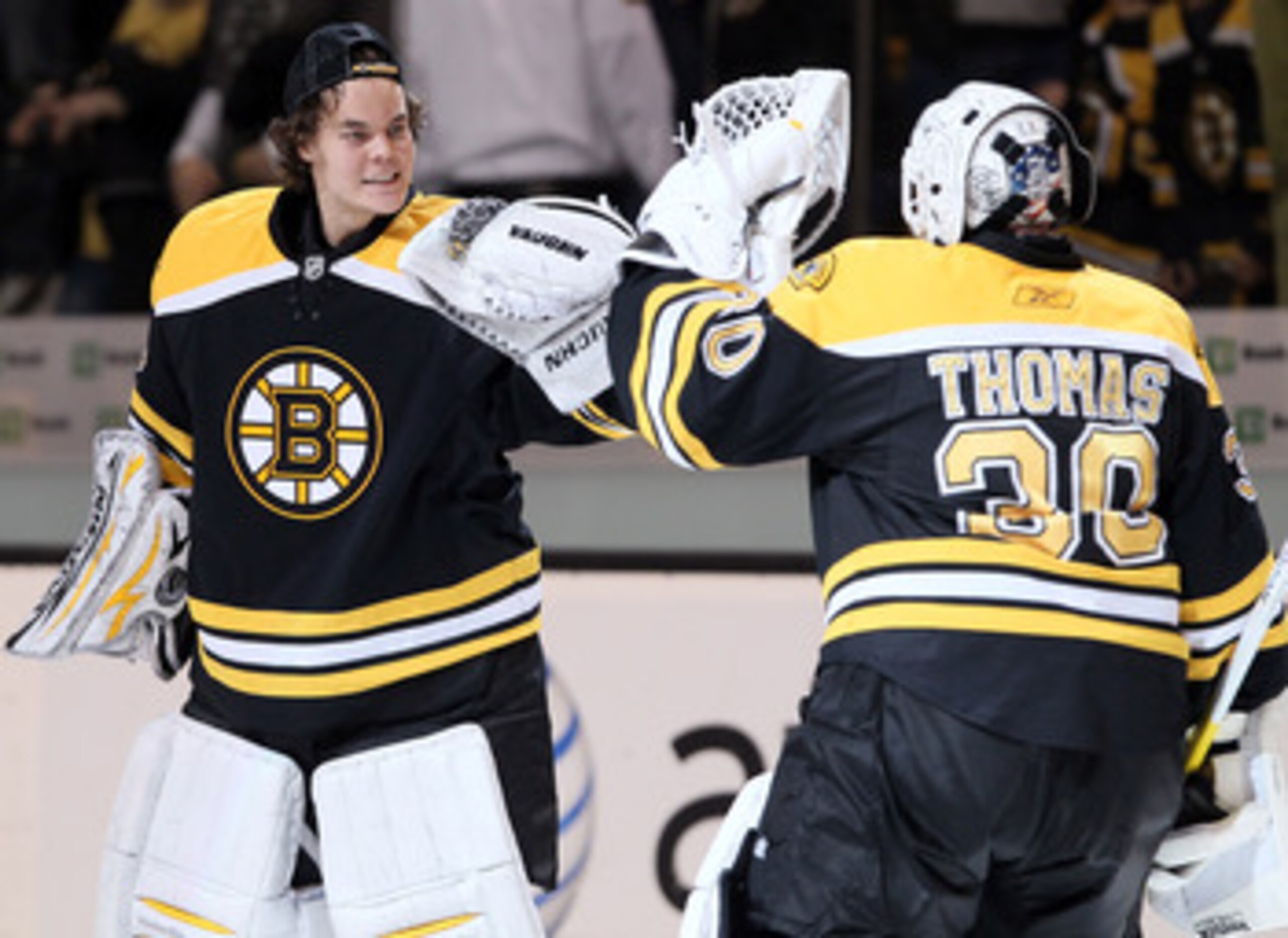 BOSTON, MA - APRIL 23:  Tuukka Rask #40 of the Boston Bruins congratulates Tim Thomas #30 after the game against the Montreal Canadiens after Game Five of the Eastern Conference Quarterfinals during the 2011 NHL Stanley Cup Playoffs at TD Garden on April 