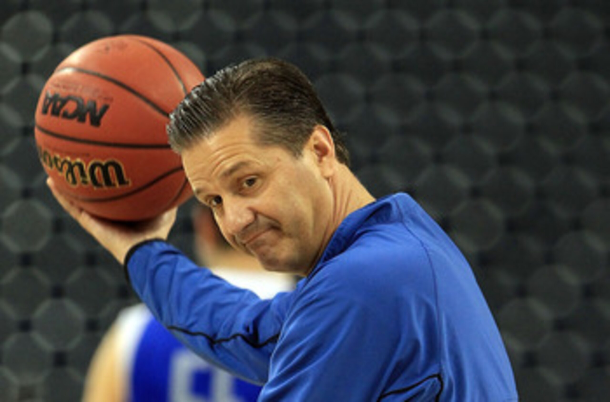 HOUSTON, TX - APRIL 01:  Head coach John Calipari of the Kentucky Wildcats throws the ball during practice prior to the 2011 Final Four of the NCAA Division I Men's Basketball Tournament at Reliant Stadium on April 1, 2011 in Houston, Texas.  (Photo by St