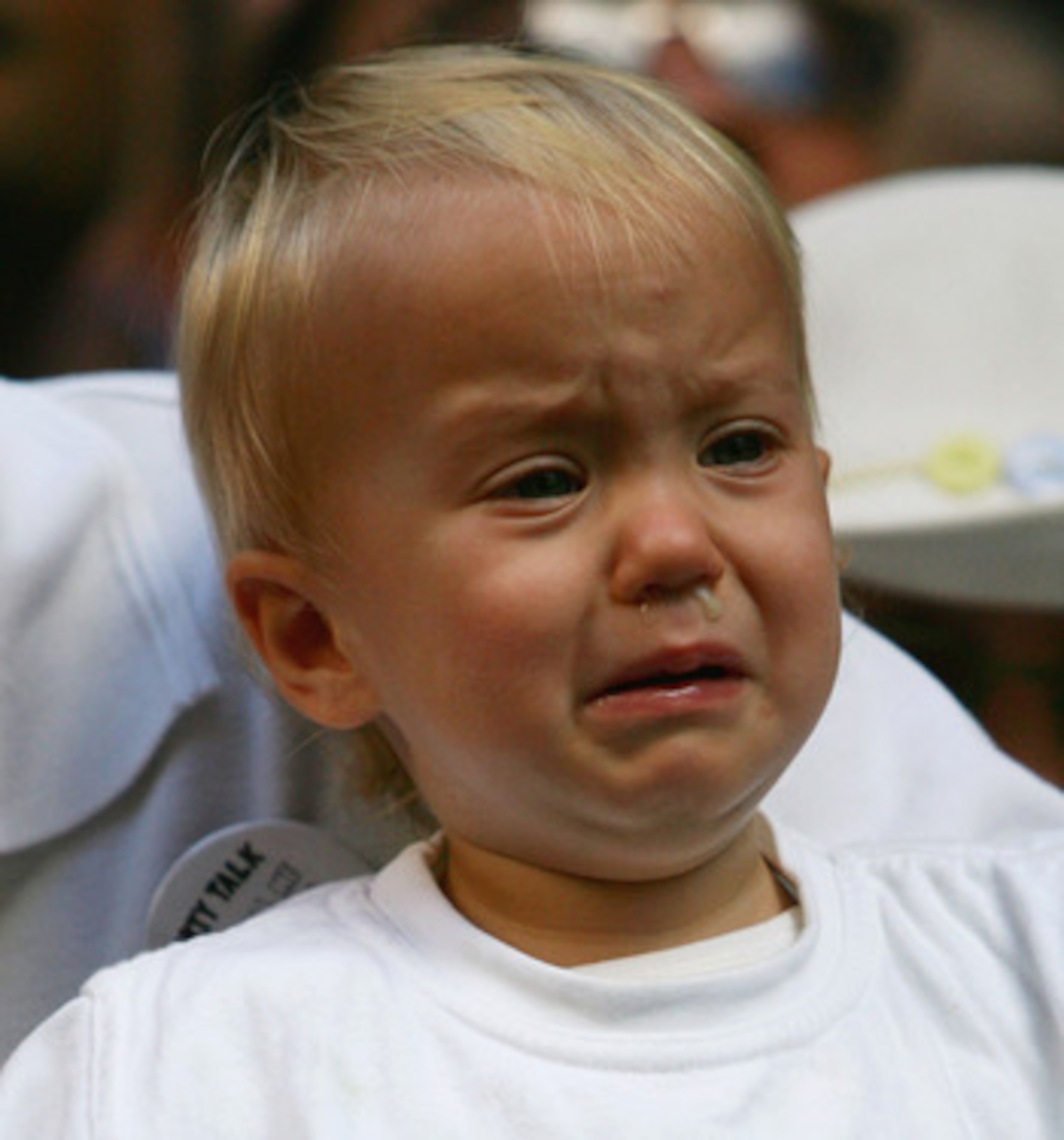 SYDNEY, AUSTRALIA - MAY 03:  A child wearing a Barmy Army T-shirt cries during a welcome home reception for the Australian Cricket team in Martin Place May 3, 2007 in Sydney, Australia.  (Photo by Ian Waldie/Getty Images)