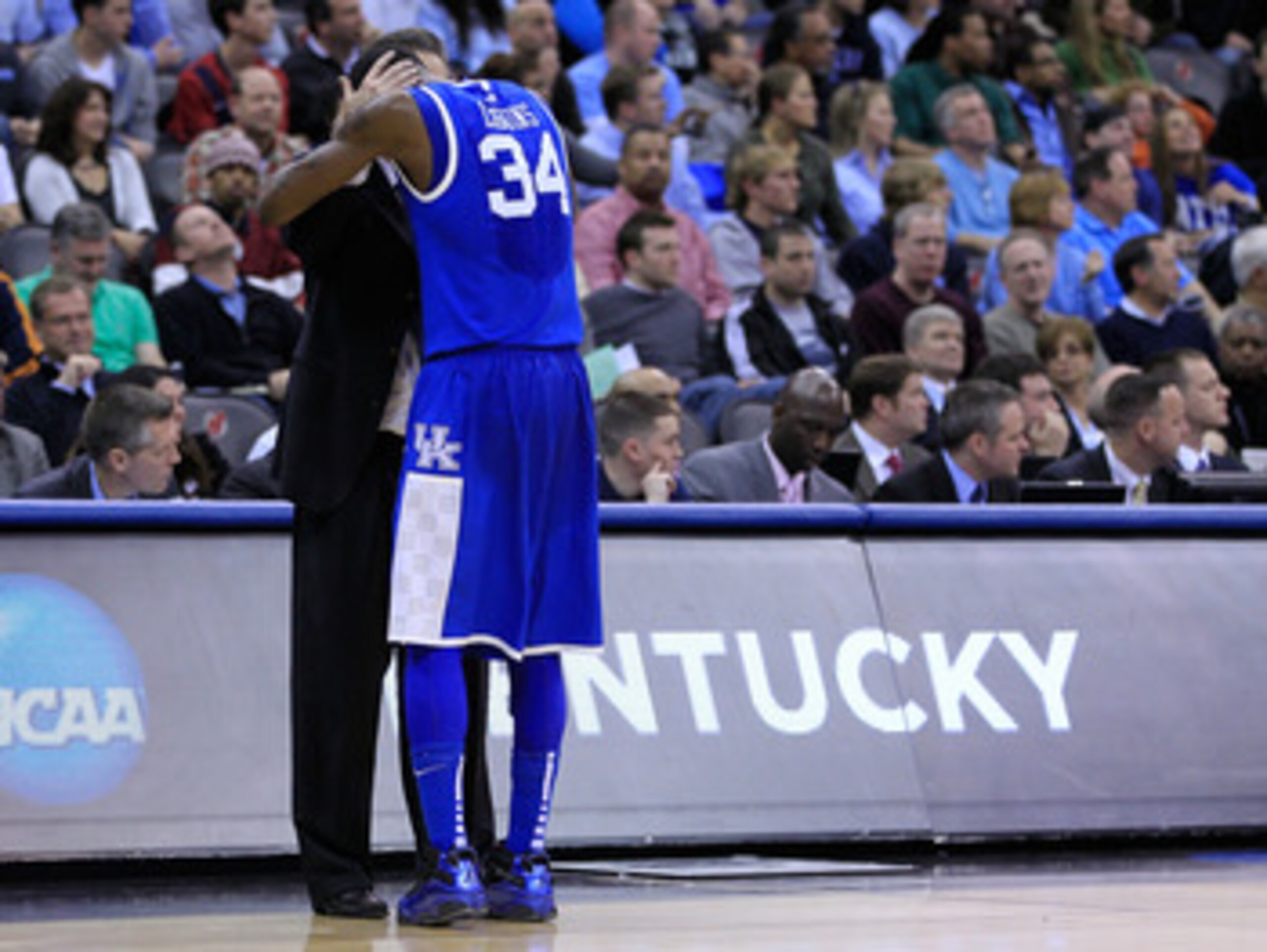 NEWARK, NJ - MARCH 27:  Head coach John Calipari (L) hugs DeAndre Liggins (R) #34 of the Kentucky Wildcats after defeating the North Carolina Tar Heels in the east regional final of the 2011 NCAA men's basketball tournament at Prudential Center on March 2