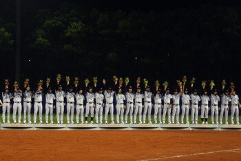 GUANGZHOU, CHINA - NOVEMBER 19:  Japan accepts their bronze medals after defeating China 6-2 at Aoti Baseball Field 1 during day seven of the 16th Asian Games Guangzhou 2010 on November 19, 2010 in Guangzhou, China.  (Photo by Richard Heathcote/Getty Imag