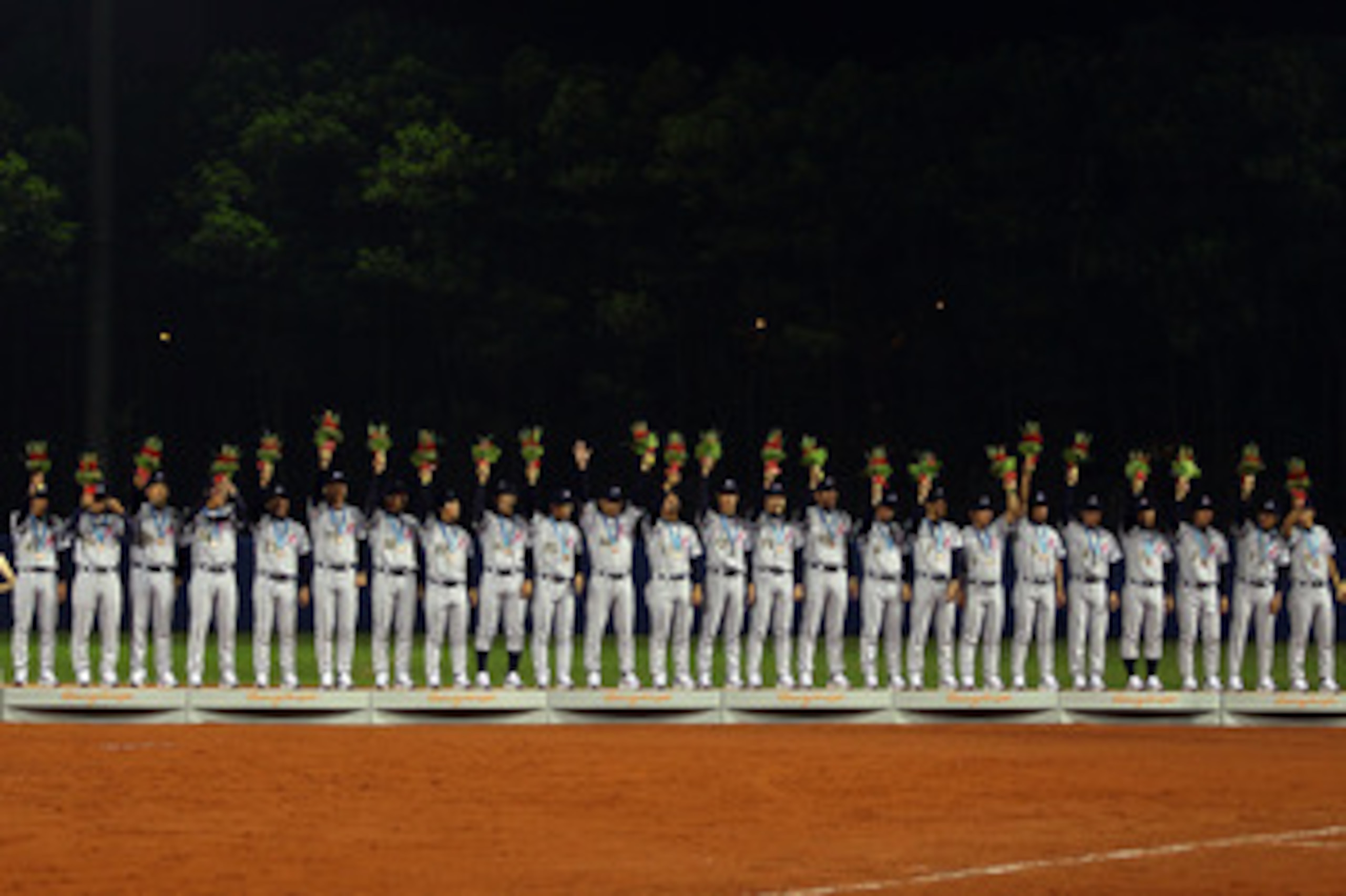 GUANGZHOU, CHINA - NOVEMBER 19:  Japan accepts their bronze medals after defeating China 6-2 at Aoti Baseball Field 1 during day seven of the 16th Asian Games Guangzhou 2010 on November 19, 2010 in Guangzhou, China.  (Photo by Richard Heathcote/Getty Imag