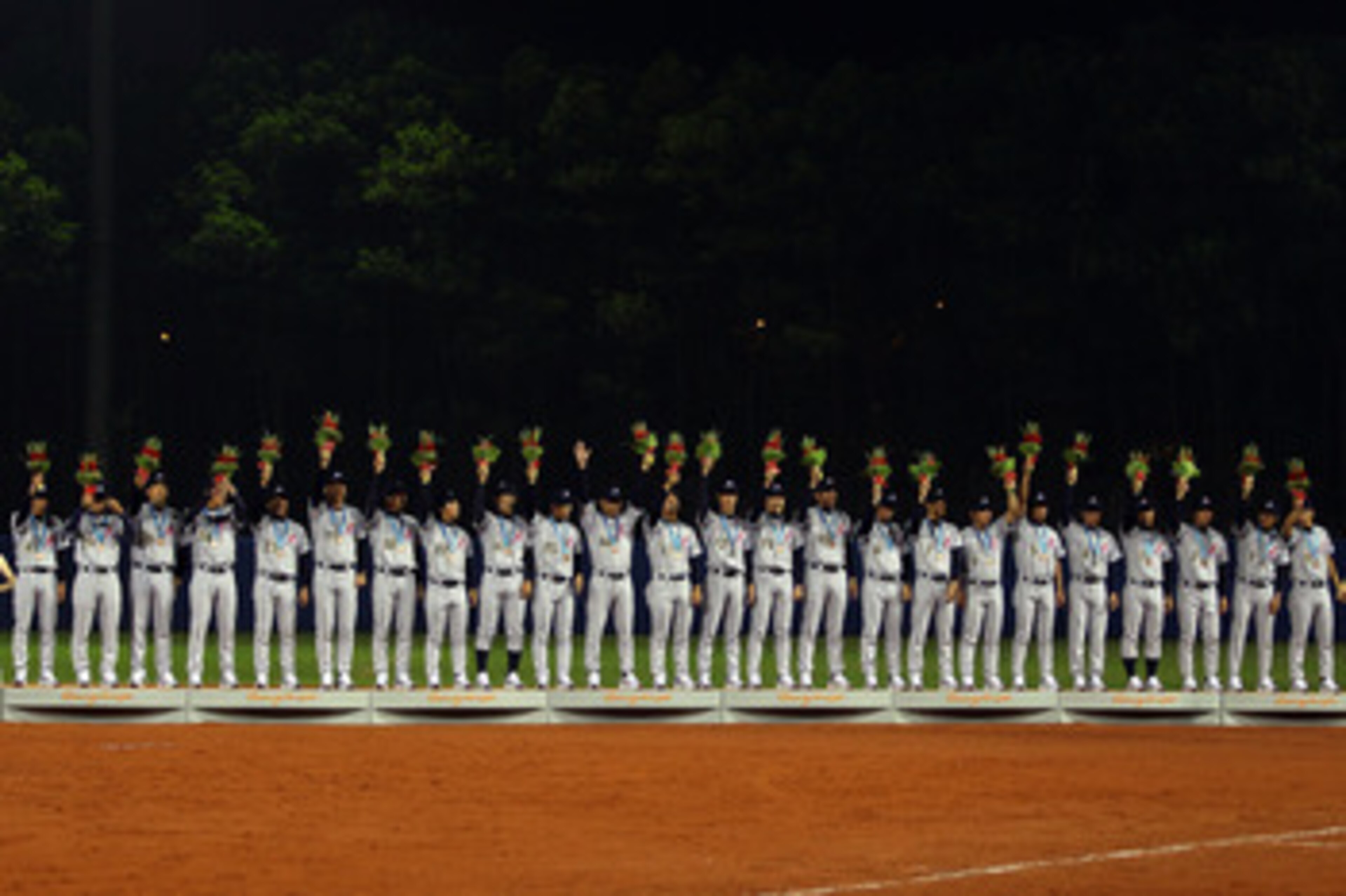 GUANGZHOU, CHINA - NOVEMBER 19:  Japan accepts their bronze medals after defeating China 6-2 at Aoti Baseball Field 1 during day seven of the 16th Asian Games Guangzhou 2010 on November 19, 2010 in Guangzhou, China.  (Photo by Richard Heathcote/Getty Imag