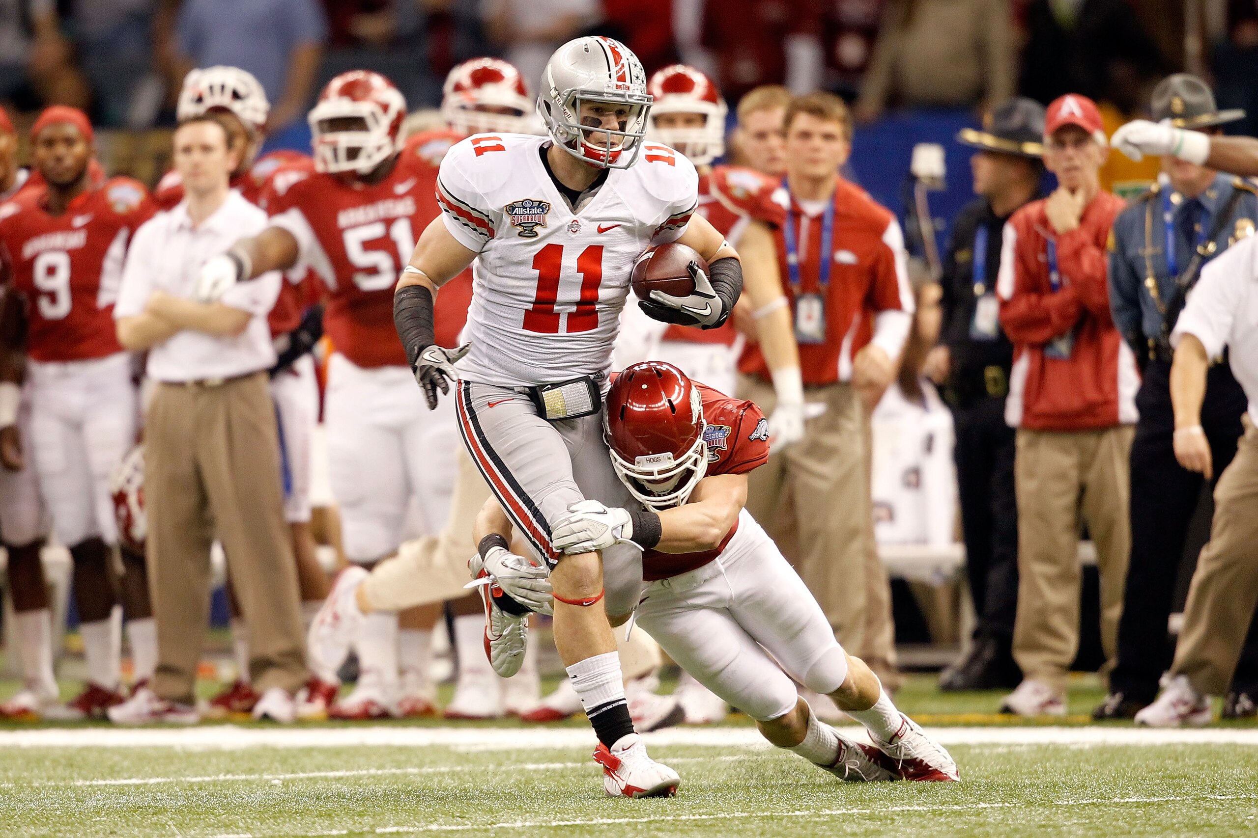 NEW ORLEANS, LA - JANUARY 04:  Jake Stoneburner #11 of the Ohio State Buckeyes runs after a catch against the Arkansas Razorbacks in the first quarter in the Allstate Sugar Bowl at the Louisiana Superdome on January 4, 2011 in New Orleans, Louisiana.  (Ph