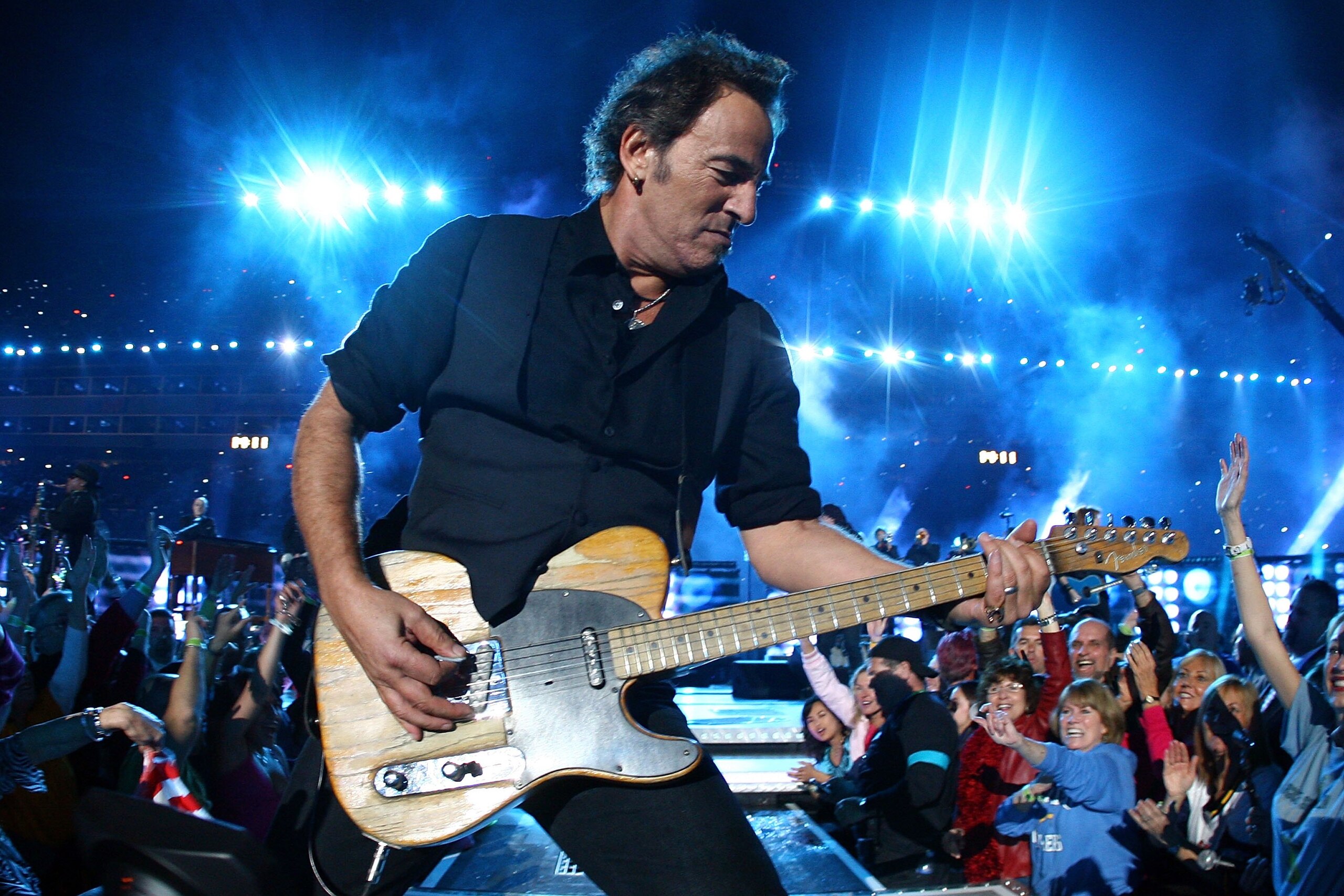 TAMPA, FL - FEBRUARY 01:  Musician Bruce Springsteen and the E Street Band  perform at the Bridgestone halftime show during Super Bowl XLIII between the Arizona Cardinals and the Pittsburgh Steelers on February 1, 2009 at Raymond James Stadium in Tampa, F