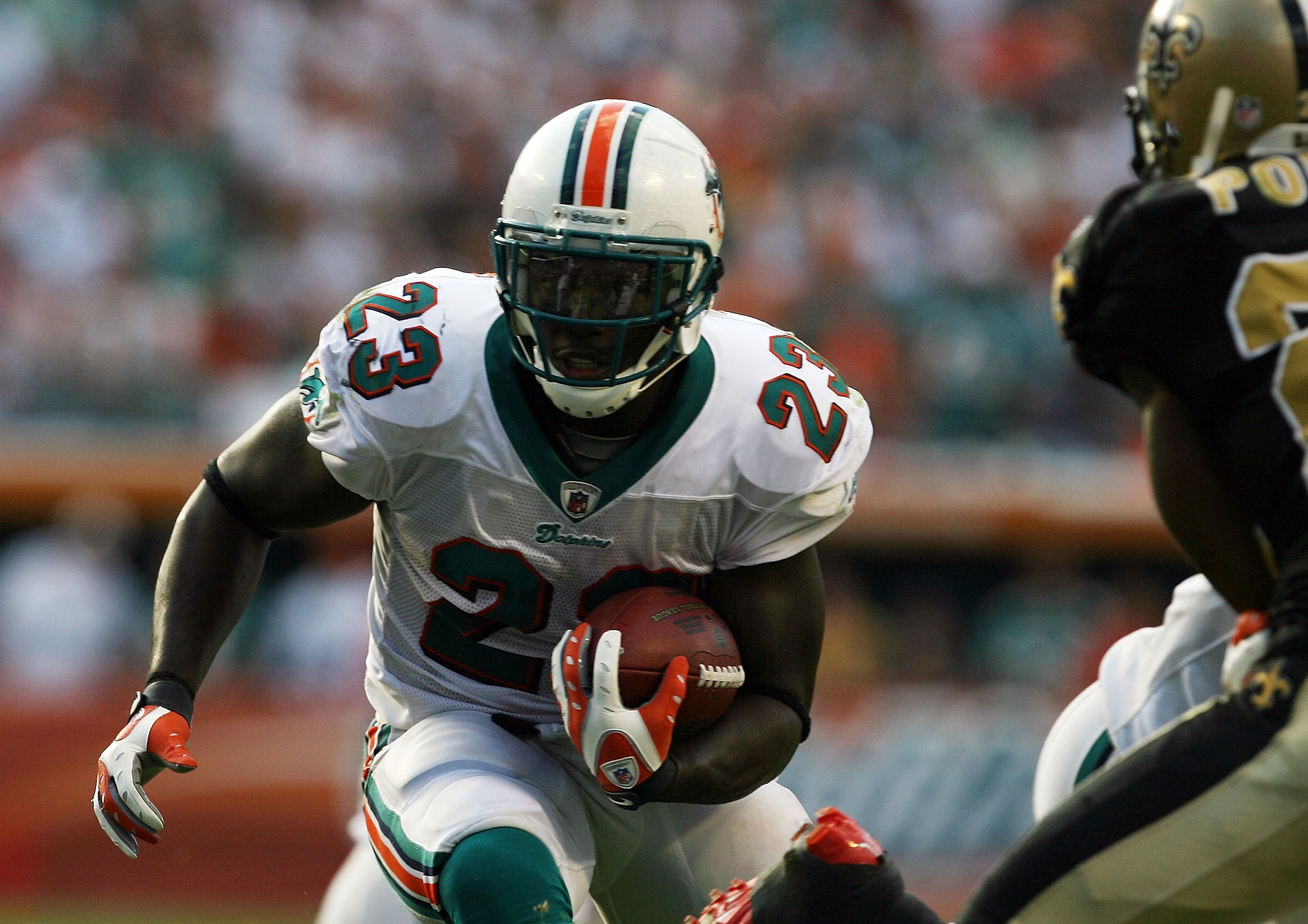 MIAMI - OCTOBER 25:  Running back Ronnie Brown #23 of the Miami Dolphins looks for room to run against the New Orleans Saints at Land Shark Stadium on October 25, 2009 in Miami, Florida.  (Photo by Doug Benc/Getty Images)