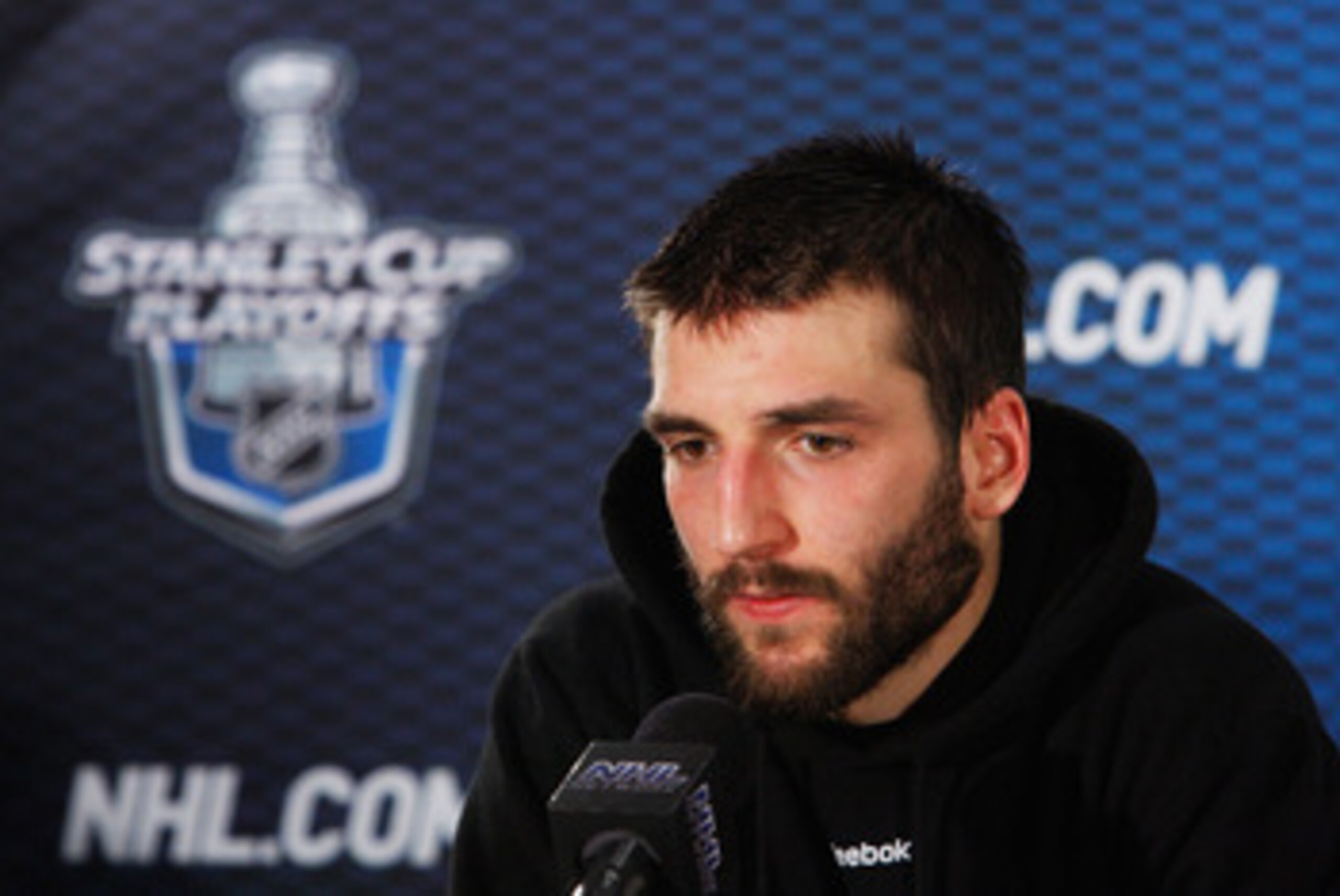 TAMPA, FL - MAY 19:  Patrice Bergeron #37 of the Boston Bruins speaks to the media after they defeated the Tampa Bay Lightning 2 to 0 in Game Three of the Eastern Conference Finals during the 2011 NHL Stanley Cup Playoffs at St Pete Times Forum on May 19,