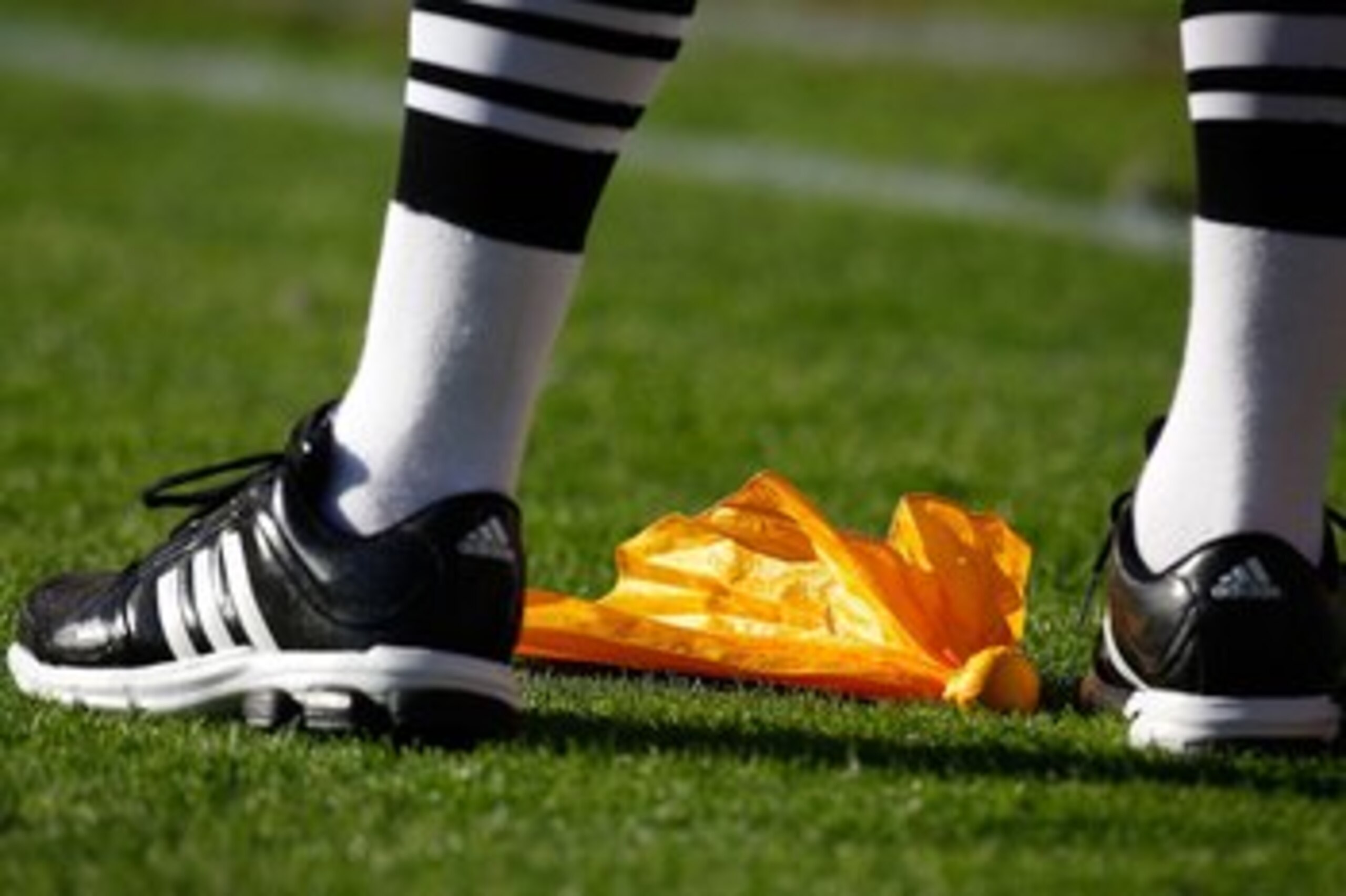 TUSCALOOSA, AL - NOVEMBER 07: An official stands over a penalty flag during the game between the Alabama Crimson Tide and the Louisiana State University Tigers at Bryant-Denny Stadium on November 7, 2009 in Tuscaloosa, Alabama. (Photo by Kevin C. Cox/Ge TUSCALOOSA, AL - NOVEMBER 07: An official stands over a penalty flag during the game between the Alabama Crimson Tide and the Louisiana State University Tigers at Bryant-Denny Stadium on November 7, 2009 in Tuscaloosa, Alabama. (Photo by Kevin C. Cox/Ge
