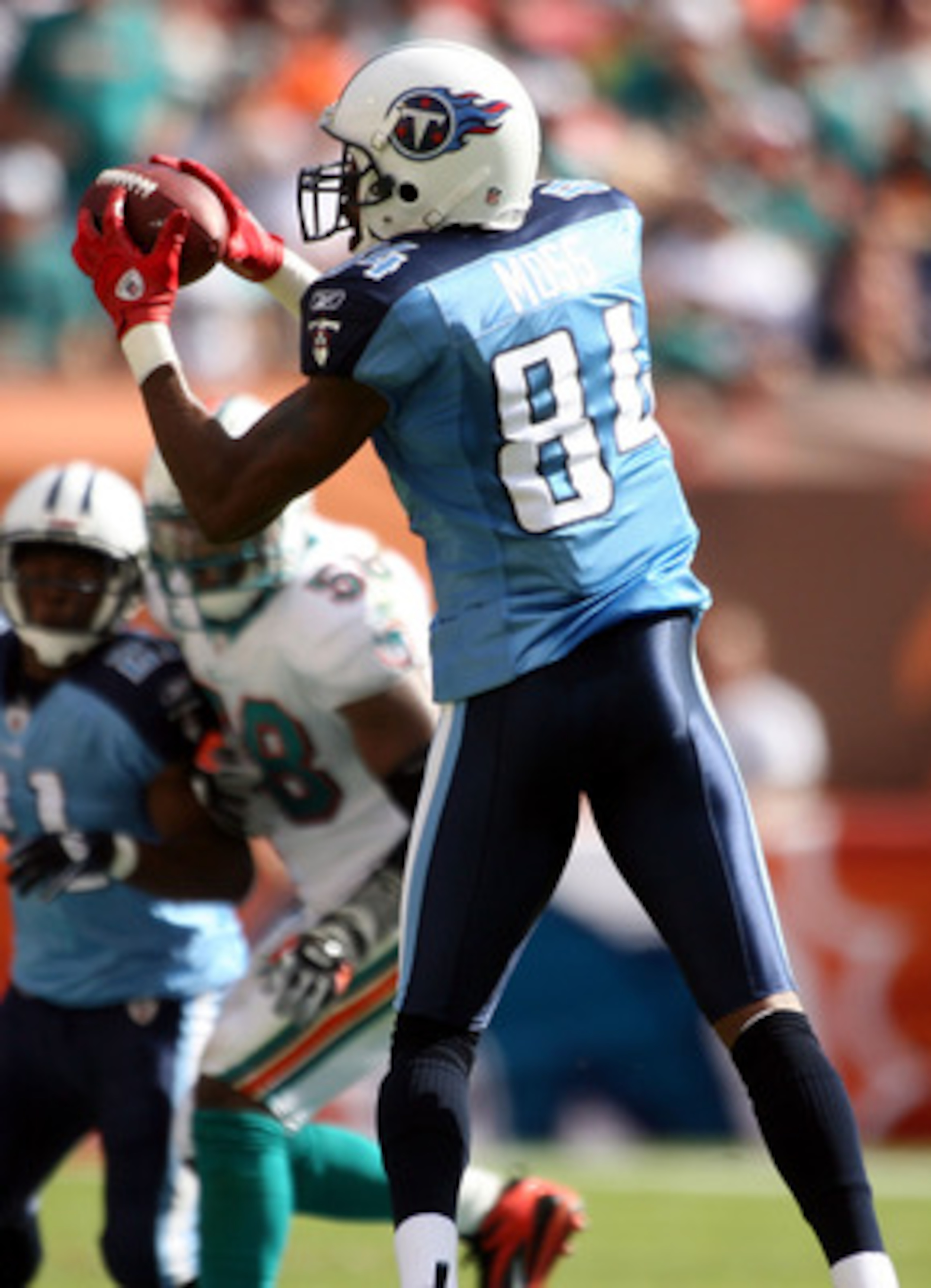 MIAMI - NOVEMBER 14:  Wide receiver Randy Moss #84 of the Tennessee Titans makes a catch against the Miami Dolphins at Sun Life Stadium on November 14, 2010 in Miami, Florida.  (Photo by Marc Serota/Getty Images)