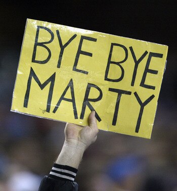DETROIT- DECEMBER 29:  A fan holds up a sign expressing his feelings on Detroit Lions head coach Marty Mornhinweg during the last game of NFL regular season against the Minnesota Vikings at Ford Field on December 29, 2002 in Detroit, Michigan.  The Viking