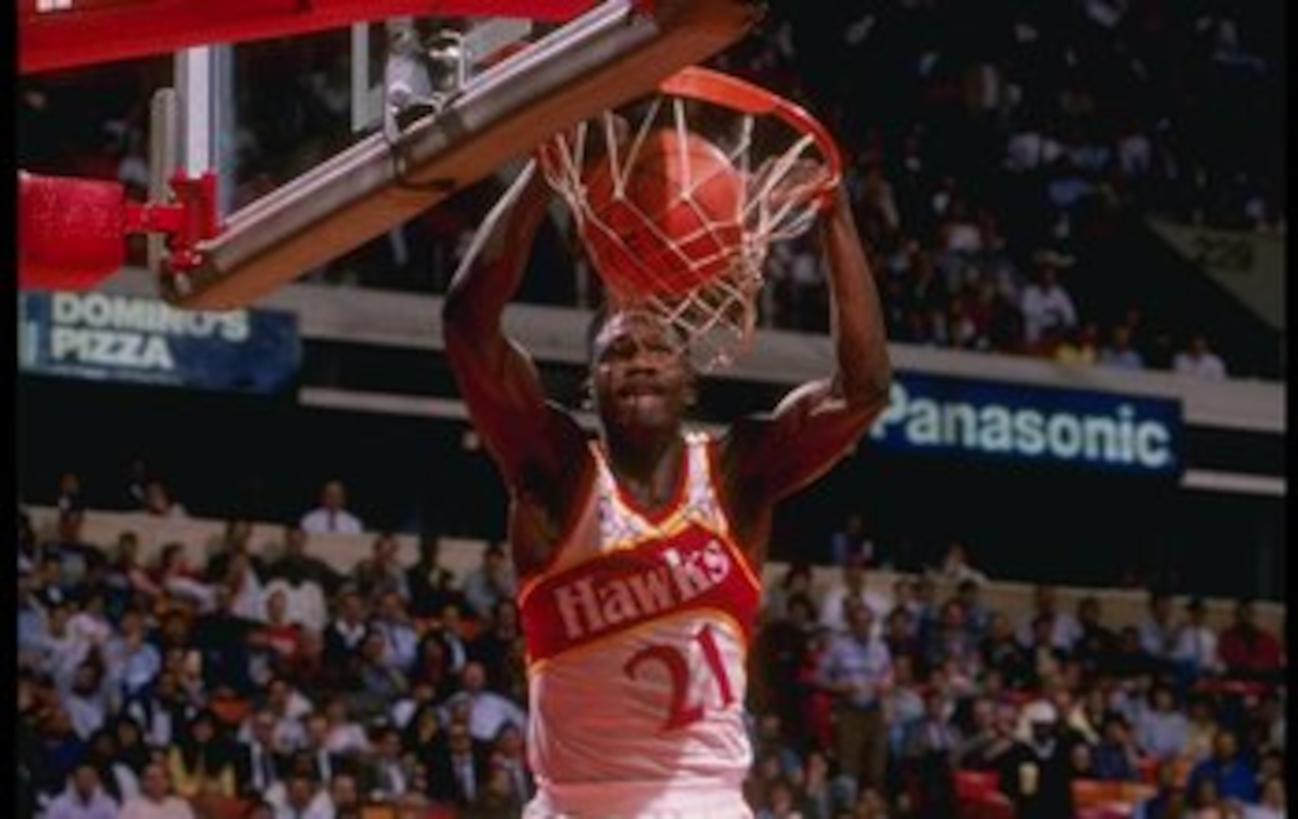 Forward Dominique Wilkins of the Atlanta Hawks slam dunks the ball during a game at the Omni in Atlanta, Georgia.