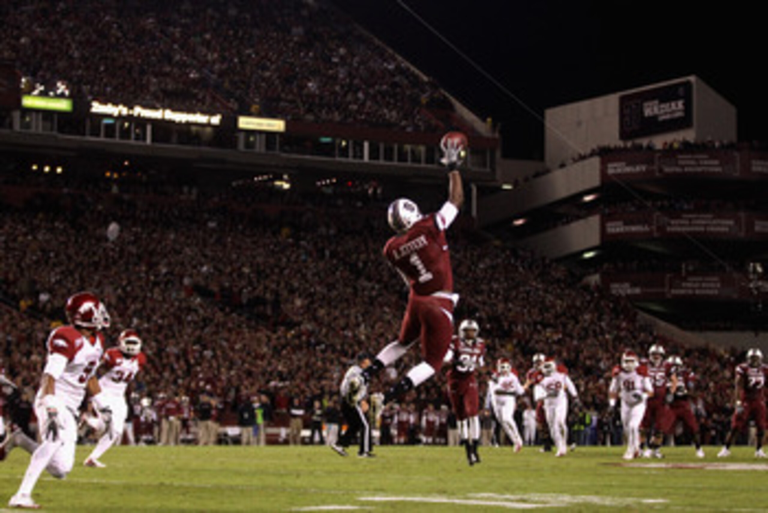 COLUMBIA, SC - NOVEMBER 06:  The defense of the Arkansas Razorbacks watch as Alshon Jeffery #1 of the South Carolina Gamecocks makes a catch during their game at Williams-Brice Stadium on November 6, 2010 in Columbia, South Carolina.  (Photo by Streeter L