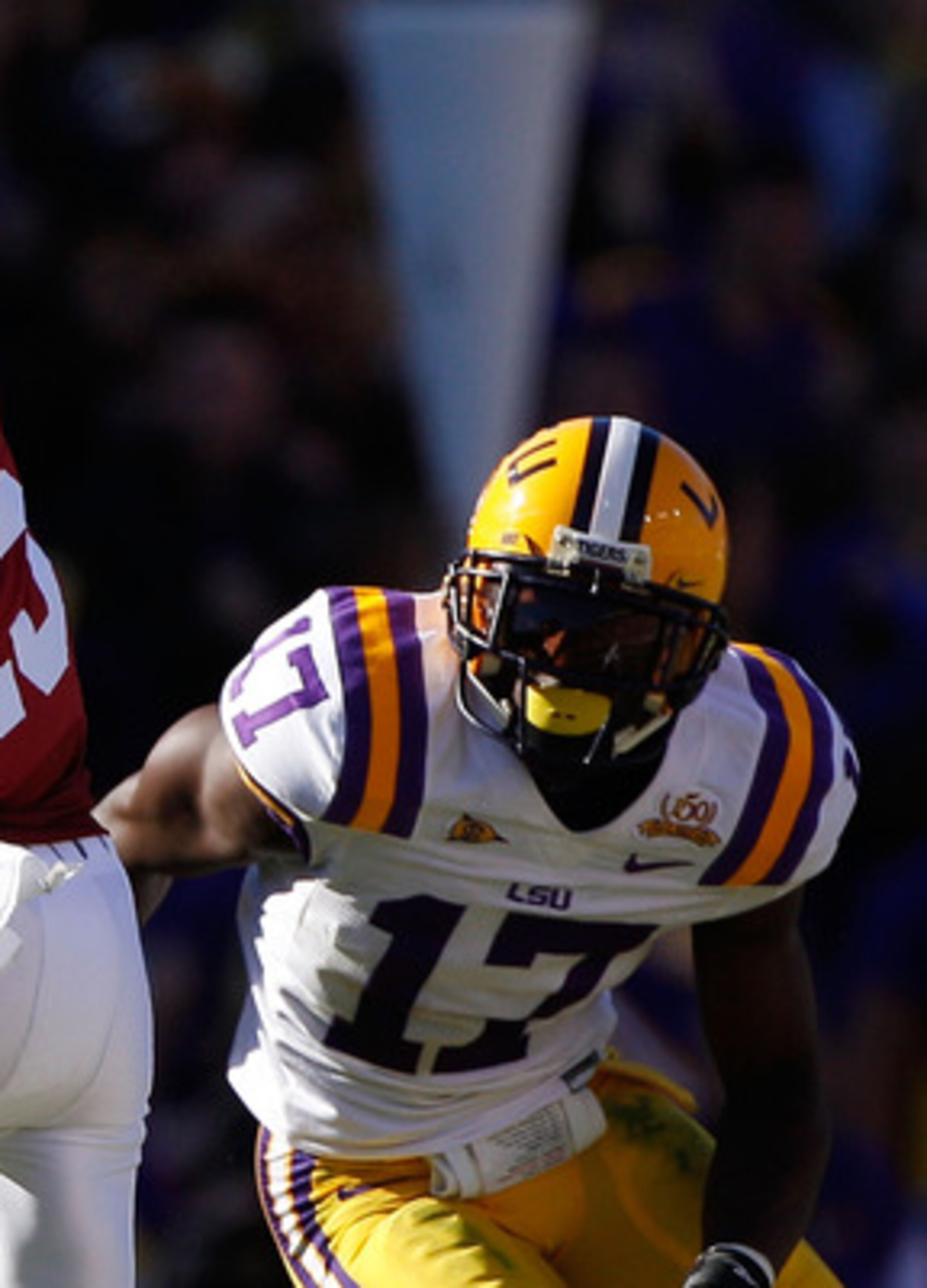 BATON ROUGE, LA - NOVEMBER 06:  Darius Hanks #15 of the Alabama Crimson Tide avoids a tackle by Morris Claiborne #17 of the Louisiana State University Tigers at Tiger Stadium on November 6, 2010 in Baton Rouge, Louisiana.  (Photo by Chris Graythen/Getty I
