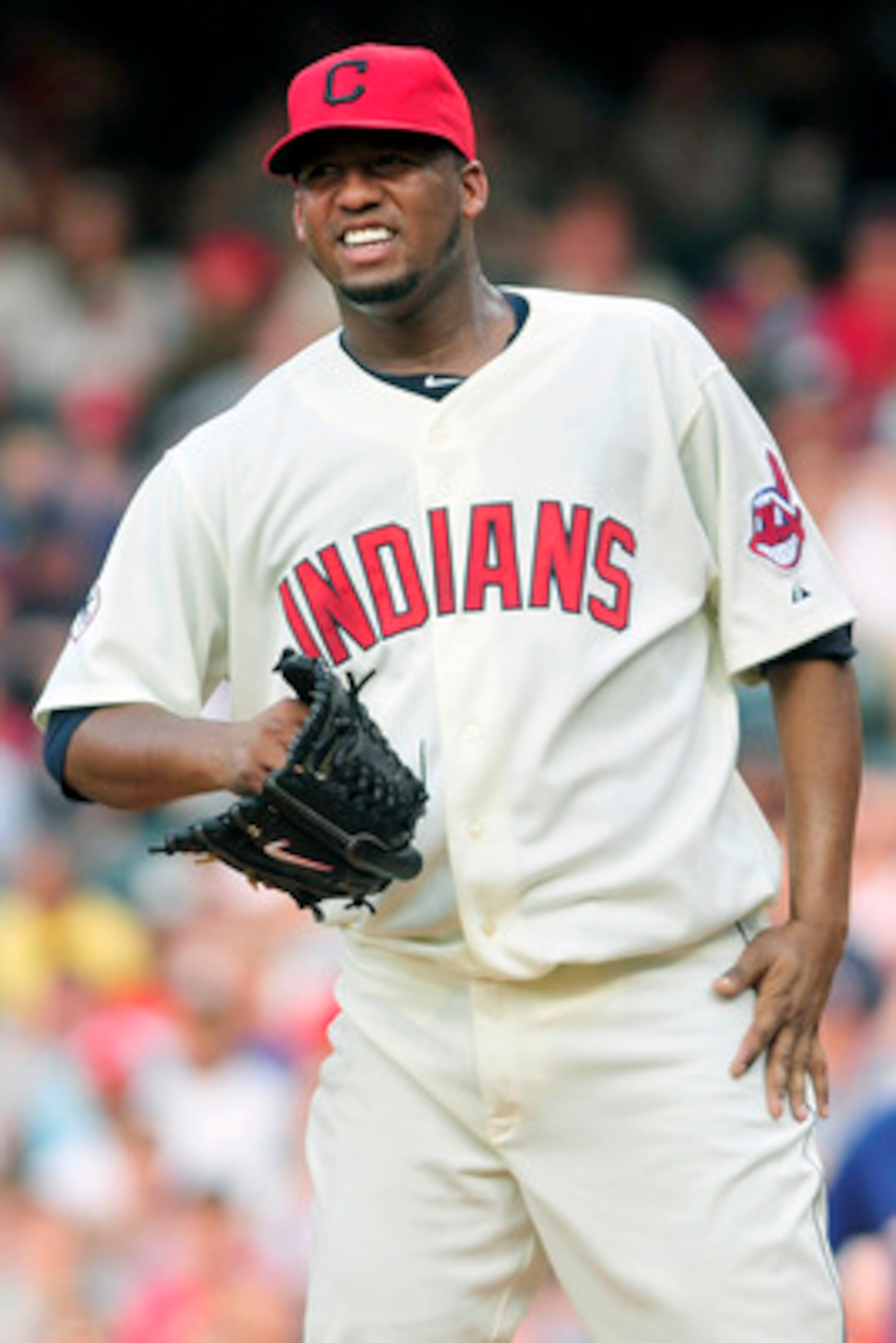 CLEVELAND, OH - JUNE 4: Fausto Carmona #55 of the Cleveland Indians reacts after giving up a base hit during the third inning against the Texas Rangers at Progressive Field on June 4, 2011 in Cleveland, Ohio. The Rangers defeated the Indians 4-0. (Photo b