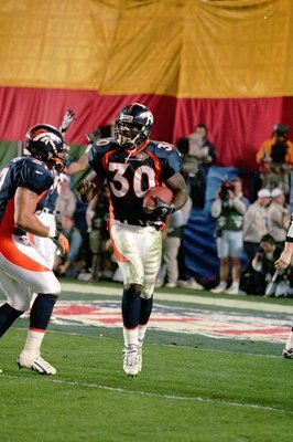 25 Jan 1998:  Terrell Davis #30 of the Denver Broncos celebrates scoring a touch down during the NFL Super Bowl XXXII Game against the Green Bay Packers at the Qualcomm Stadium in San Diego, California. The Broncos defeated the Packers 31-24. Mandatory Cr