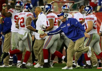 GLENDALE, AZ - FEBRUARY 03:  Head coach Tom Coughlin of the New York Giants congratulates Osi Umenyiora #72 during Super Bowl XLII against the New England Patriots on February 3, 2008 at the University of Phoenix Stadium in Glendale, Arizona.  (Photo by D