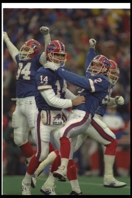 3 Jan 1993: Quarterback Frank Reich of the Buffalo Bills (left) celebrates with teammate kicker Steve Christie after a playoff game against the Houston Oilers at Rich Stadium in Orchard Park, New York. The Bills won the game in overtime, 41-38.