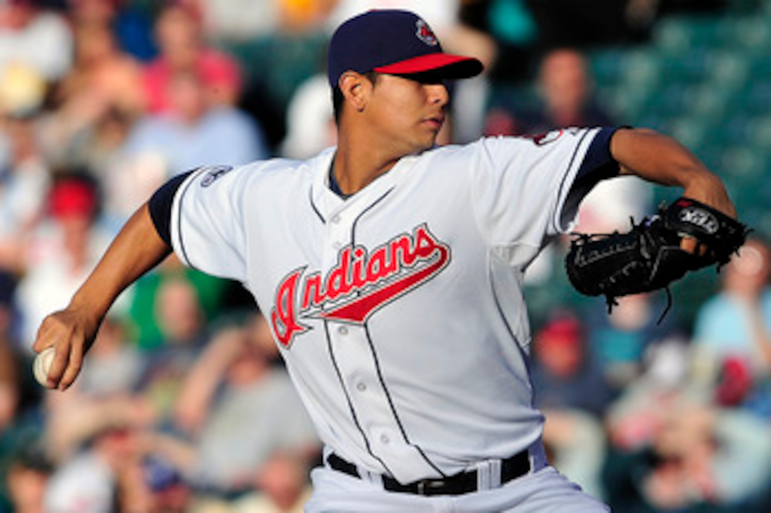 CLEVELAND, OH - JUNE 2:  Starting pitcher Carlos Carrasco #59 of the Cleveland Indians pitches during the second inning against the Texas Rangers at Progressive Field on June 2, 2011 in Cleveland, Ohio. (Photo by Jason Miller/Getty Images)