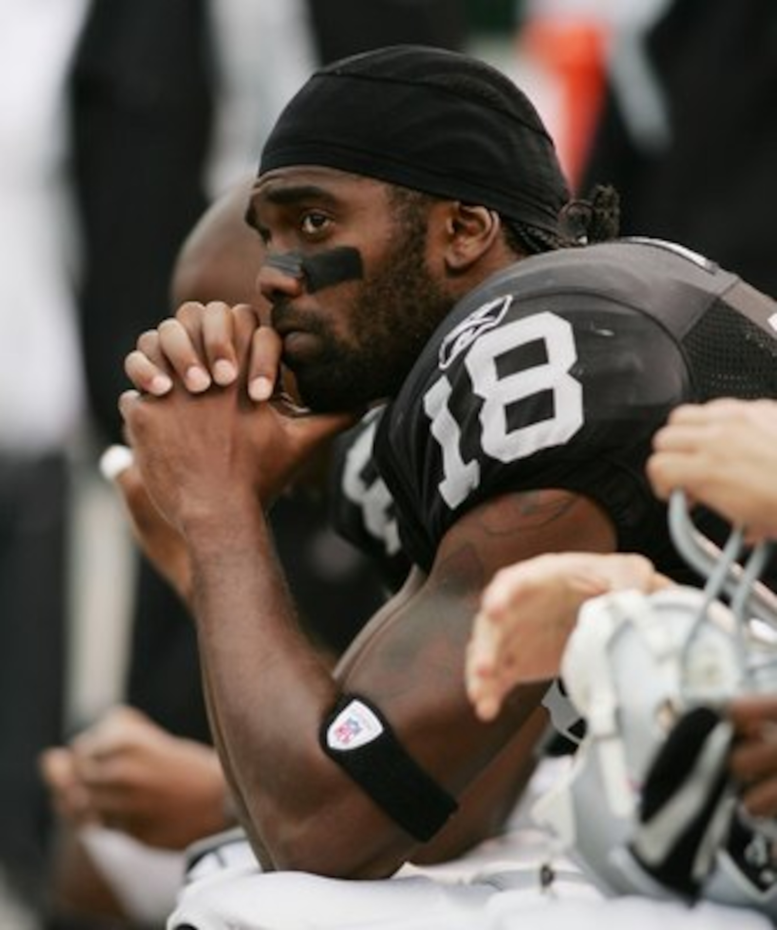 OAKLAND, CA - OCTOBER 01:  Randy Moss #18 of the Oakland Raiders looks on towards the end of the game against the Cleveland Browns on October 1, 2006 at McAfee Coliseum in Oakland, California. The Browns defeated the Raiders 24-21.  (Photo by Jonathan Fer