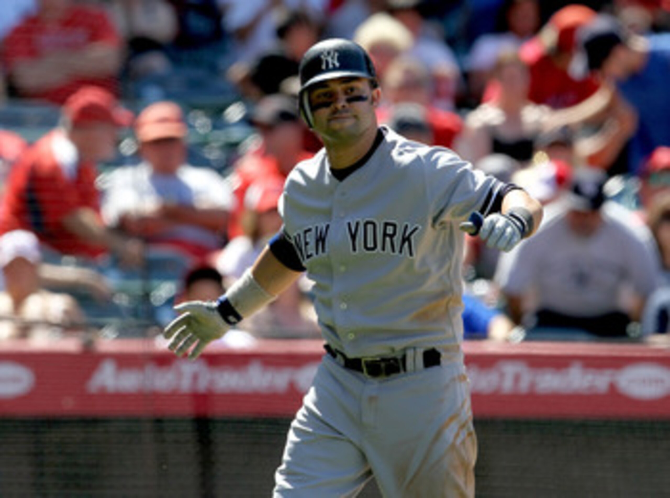 ANAHEIM, CA - JUNE 05:  Nick Swisher #33 of the New York Yankees celebrates after hitting a solo home run in the eighth inning against the Los Angeles Angels of Anaheim on June 5, 2011 at Angel Stadium in Anaheim, California.  The Yankees won 5-3.  (Photo