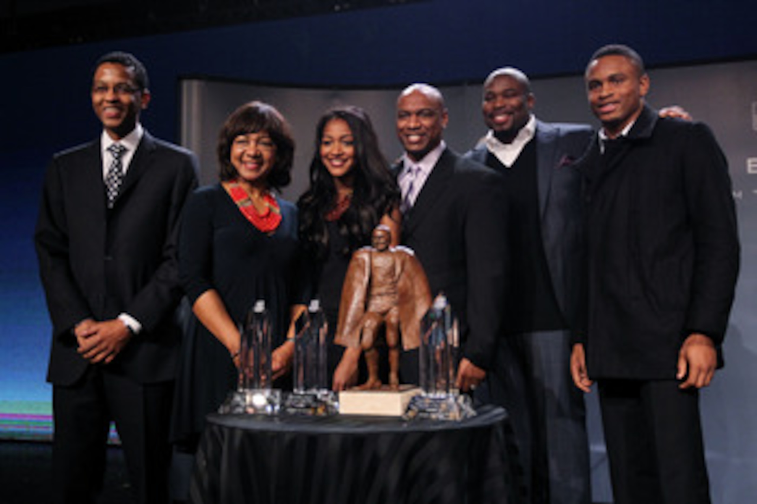 DALLAS, TX - FEBRUARY 04:  Walter Payton NFL Man of the Year Award finalists Nnamdi Asomugha (R) of the Oakland Raiders and Israel Idonije (2ndR) of the Chicago Bears pose with the Peyton family, Connie Payton (2ndL), wife of former Chicago Bears great Wa