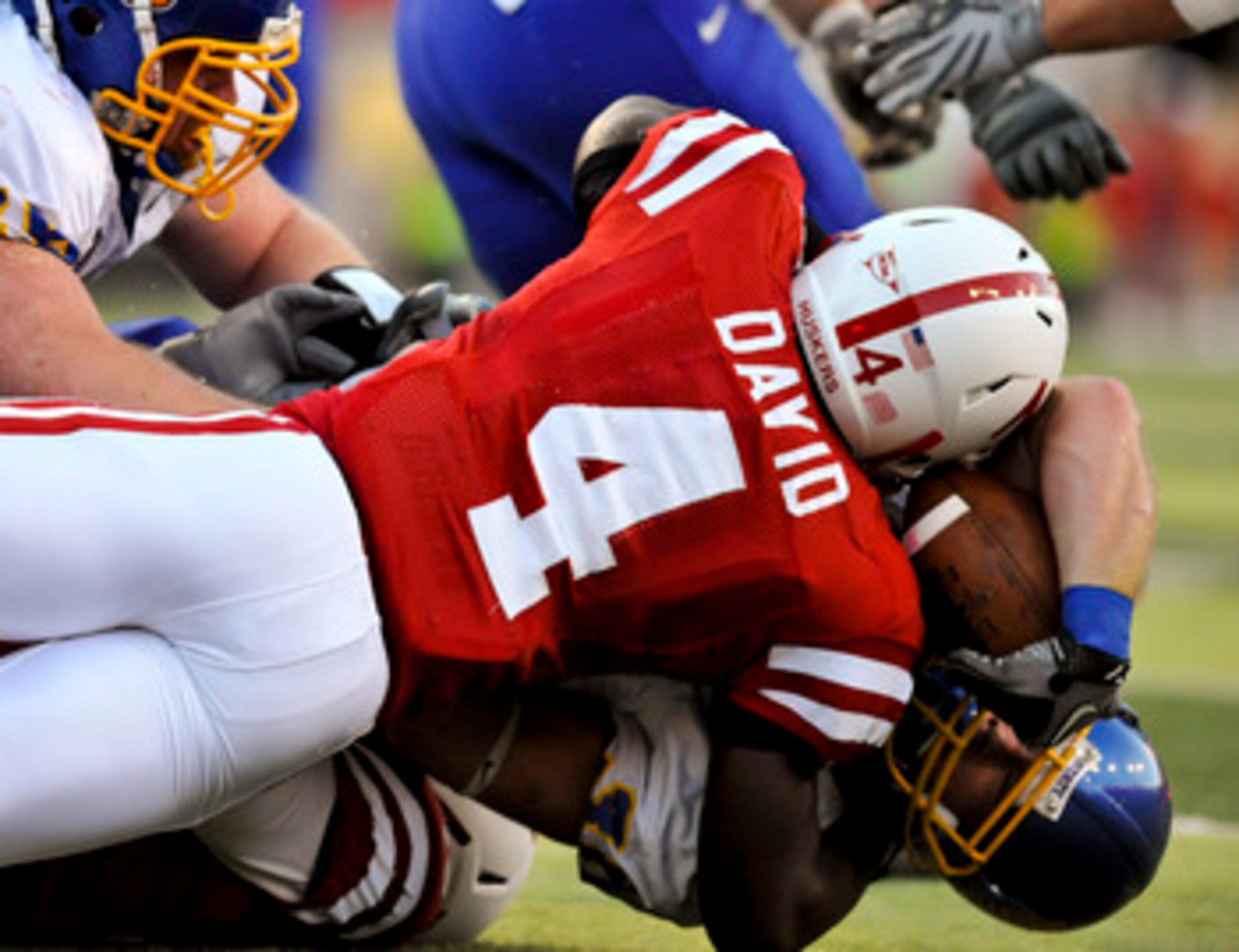 LINCOLN, NEBRASKA - SEPTEMBER 25: Nebraska Cornhuskers linebacker Lavonte David #4 tackles South Dakota State Jackrabbits running back Kyle Minett #30 during first half action of their game at Memorial Stadium on September 25, 2010 in Lincoln, Nebraska. N LINCOLN, NEBRASKA - SEPTEMBER 25: Nebraska Cornhuskers linebacker Lavonte David #4 tackles South Dakota State Jackrabbits running back Kyle Minett #30 during first half action of their game at Memorial Stadium on September 25, 2010 in Lincoln, Nebraska. N