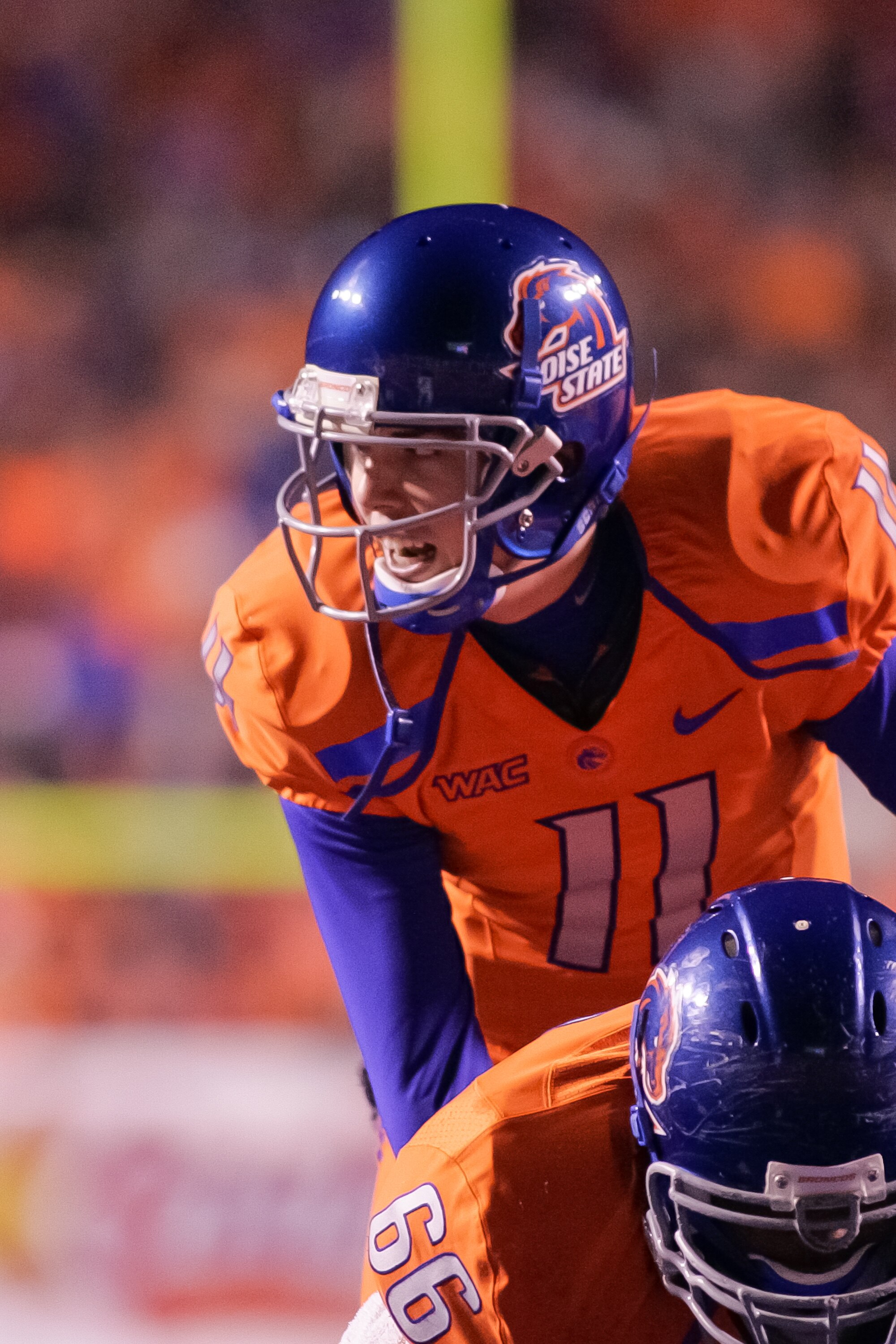 BOISE, ID - NOVEMBER 19:  Kellen Moore #11 of the Boise State Broncos calls the play against the Fresno State Bulldogs at Bronco Stadium on November 19, 2010 in Boise, Idaho.  (Photo by Otto Kitsinger III/Getty Images)