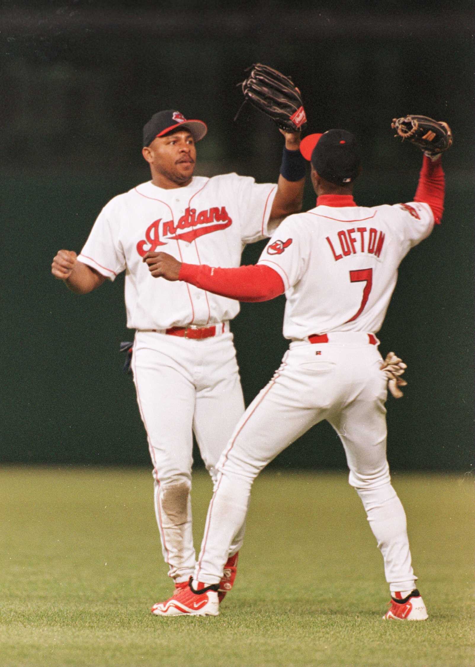 4 Oct 1996: Albert Belle, left and Kenny Lofton of the Cleveland Indians high glove each other after the Indians defeated the Orioles 9-4 in game three of the American League Divisional Series at Jacobs Field in Cleveland, Ohio.